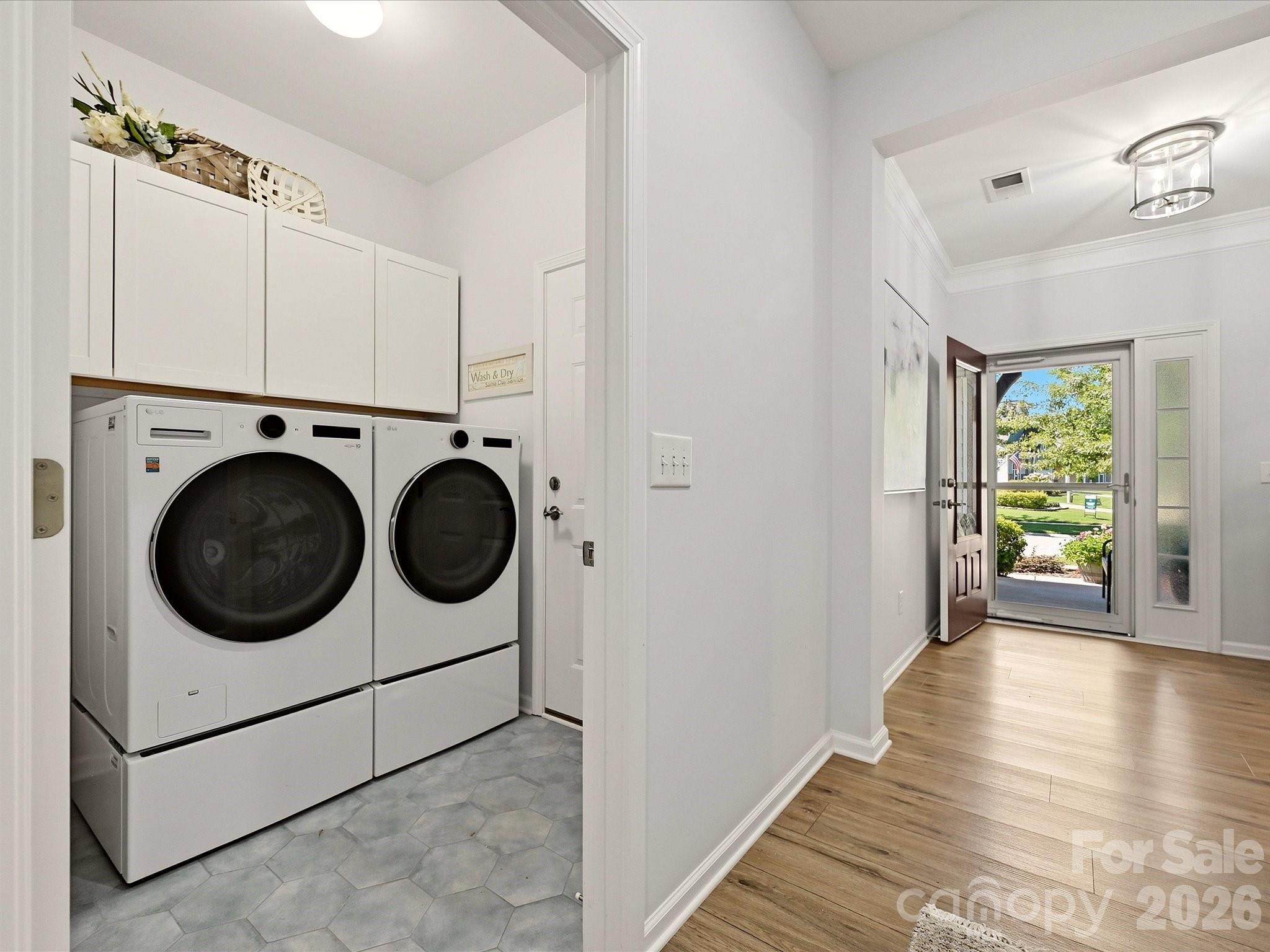 Laundry Room with New Flooring and Cabinets added over appliances - 5060 Big Bend Drive, Lancaster