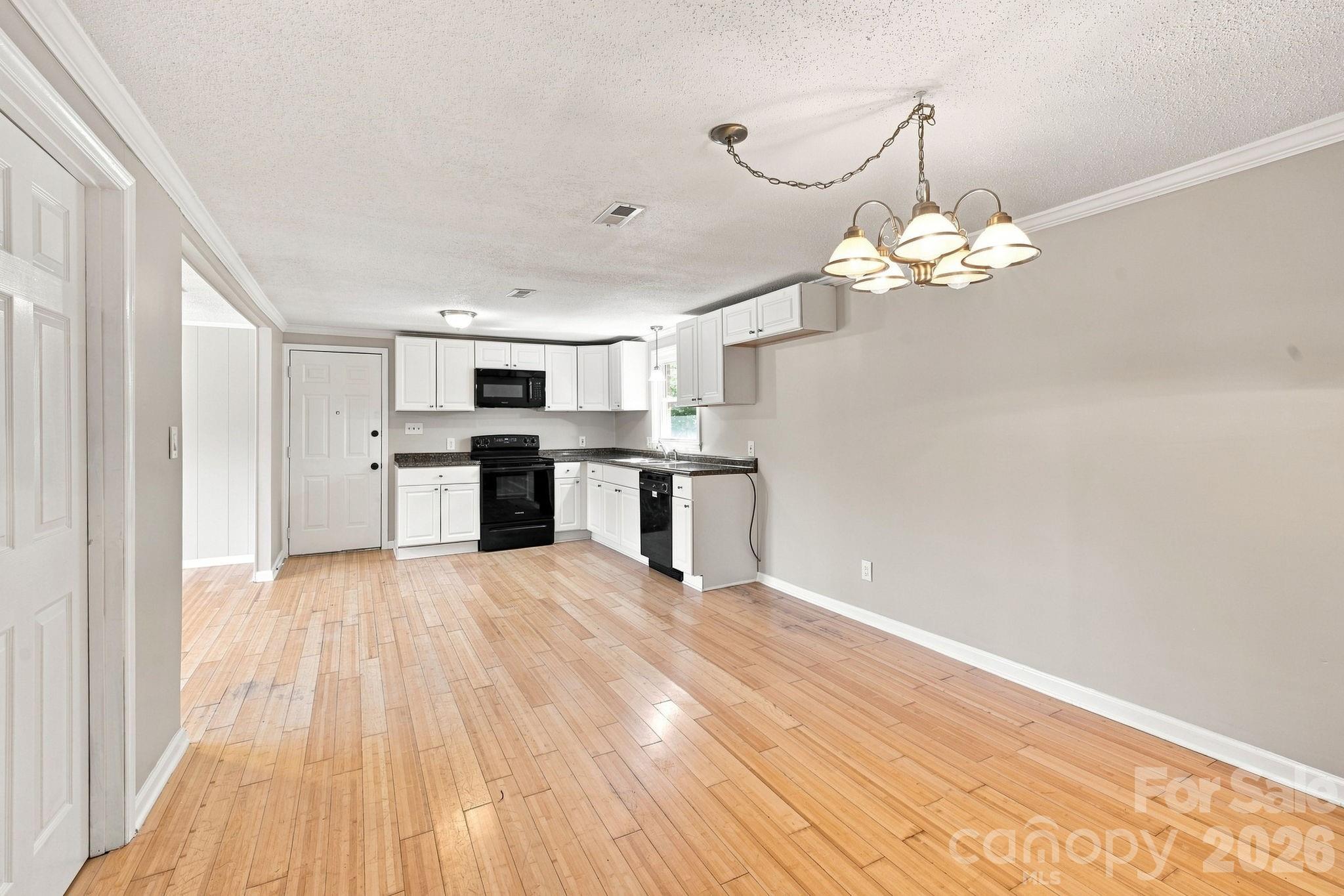 Dining area looking toward the kitchen - 1021 S Caldwell Avenue, Newton