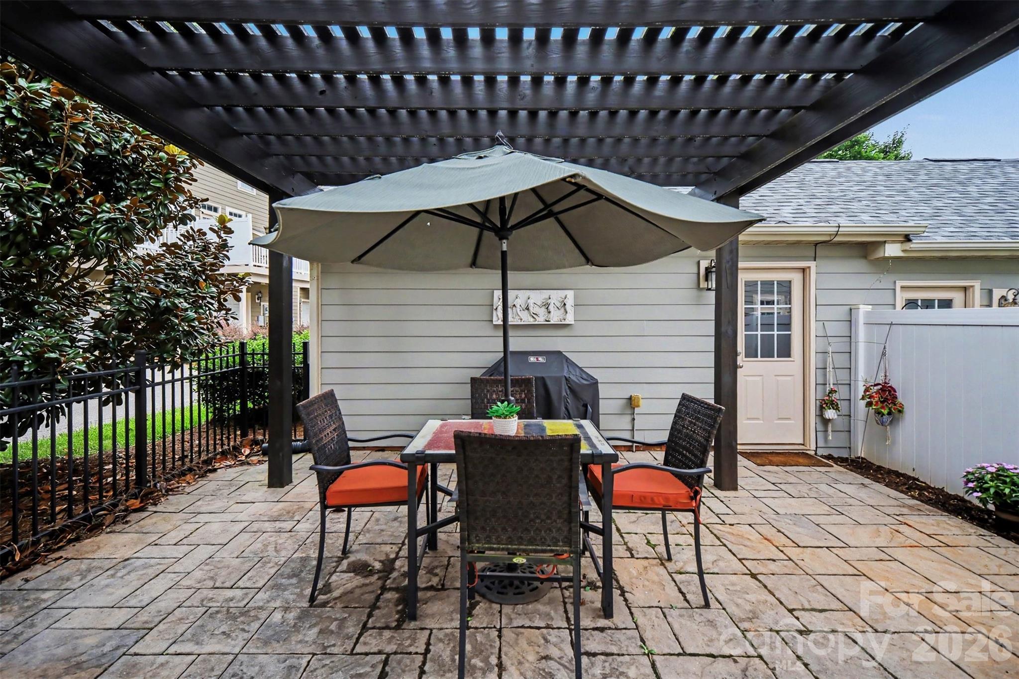 Largest courtyard the neighborhood! Pavers, fountain, pergola, and privacy! - 438 Magnolia Street, Davidson