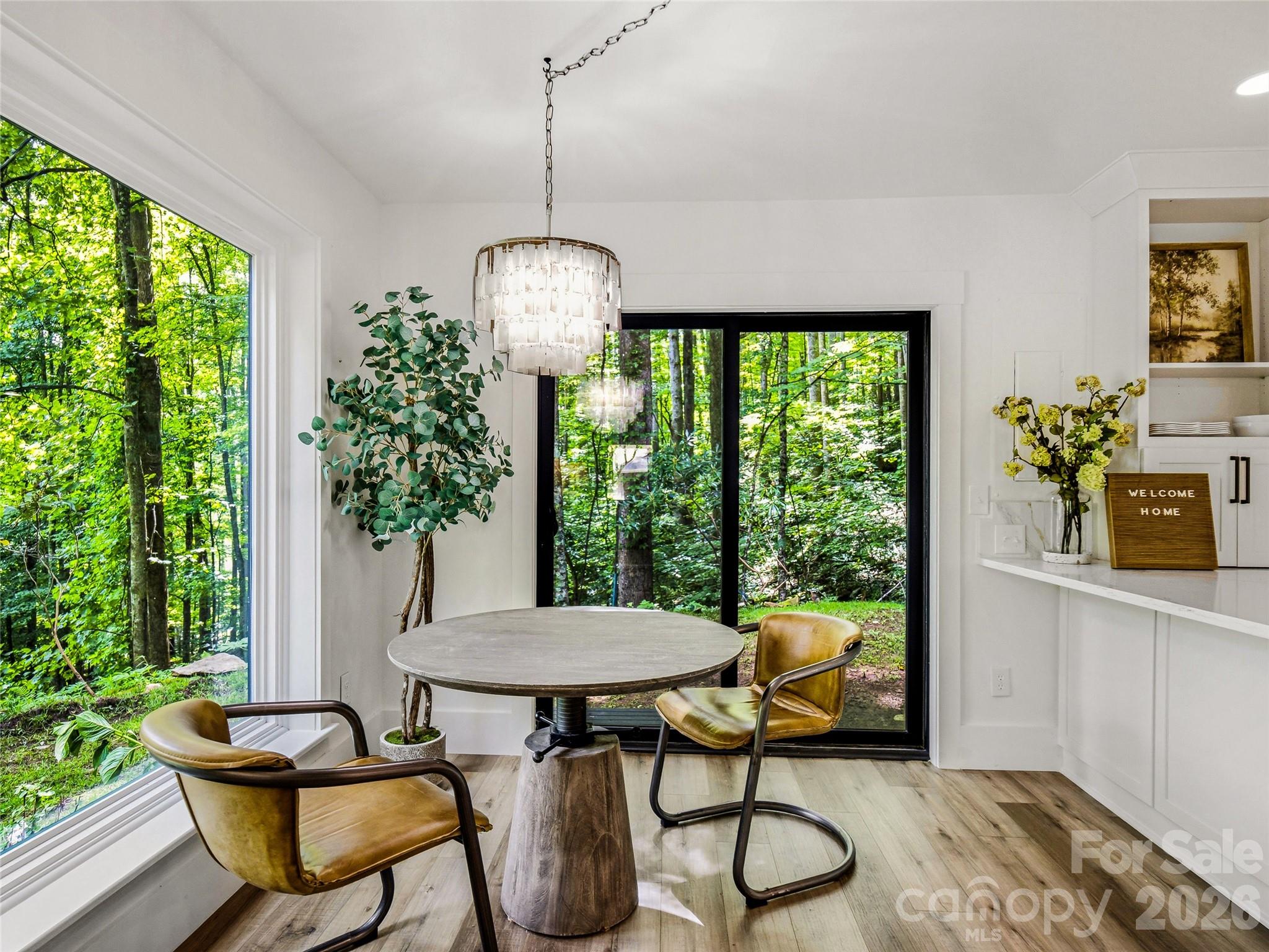 Breakfast nook with forest views. - 81 Summer Trees Lane, Burnsville
