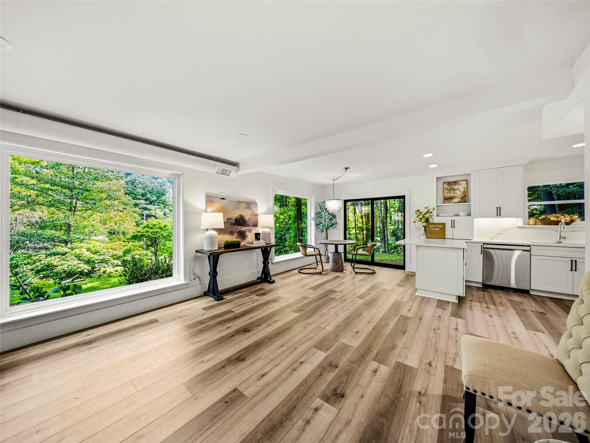 This bright, flexible main-level space offers options for a formal dining room, additional living area, or a combination of both. - 81 Summer Trees Lane, Burnsville