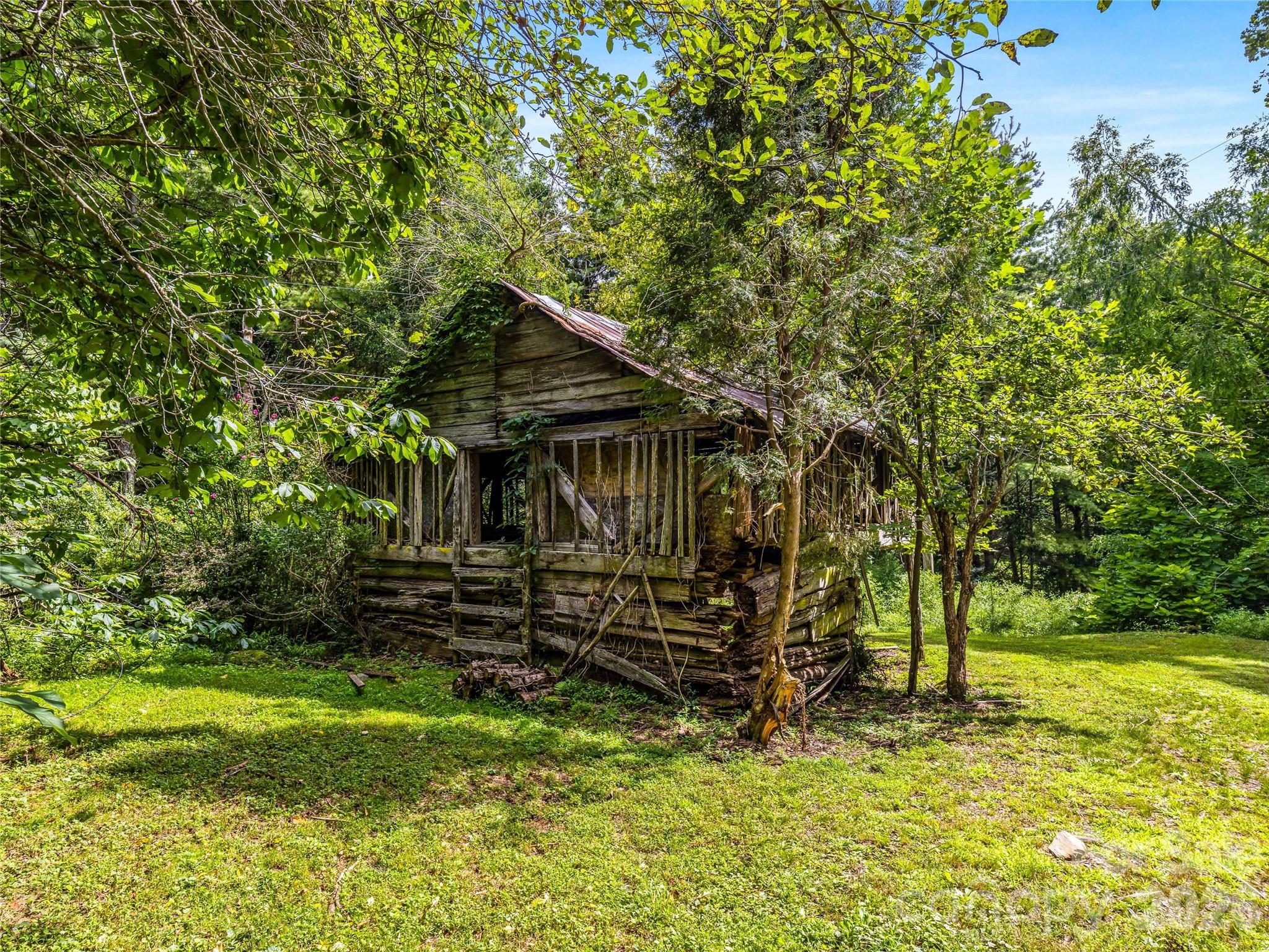A picturesque antique barn adds timeless mountain character to the peaceful landscape. - 81 Summer Trees Lane, Burnsville