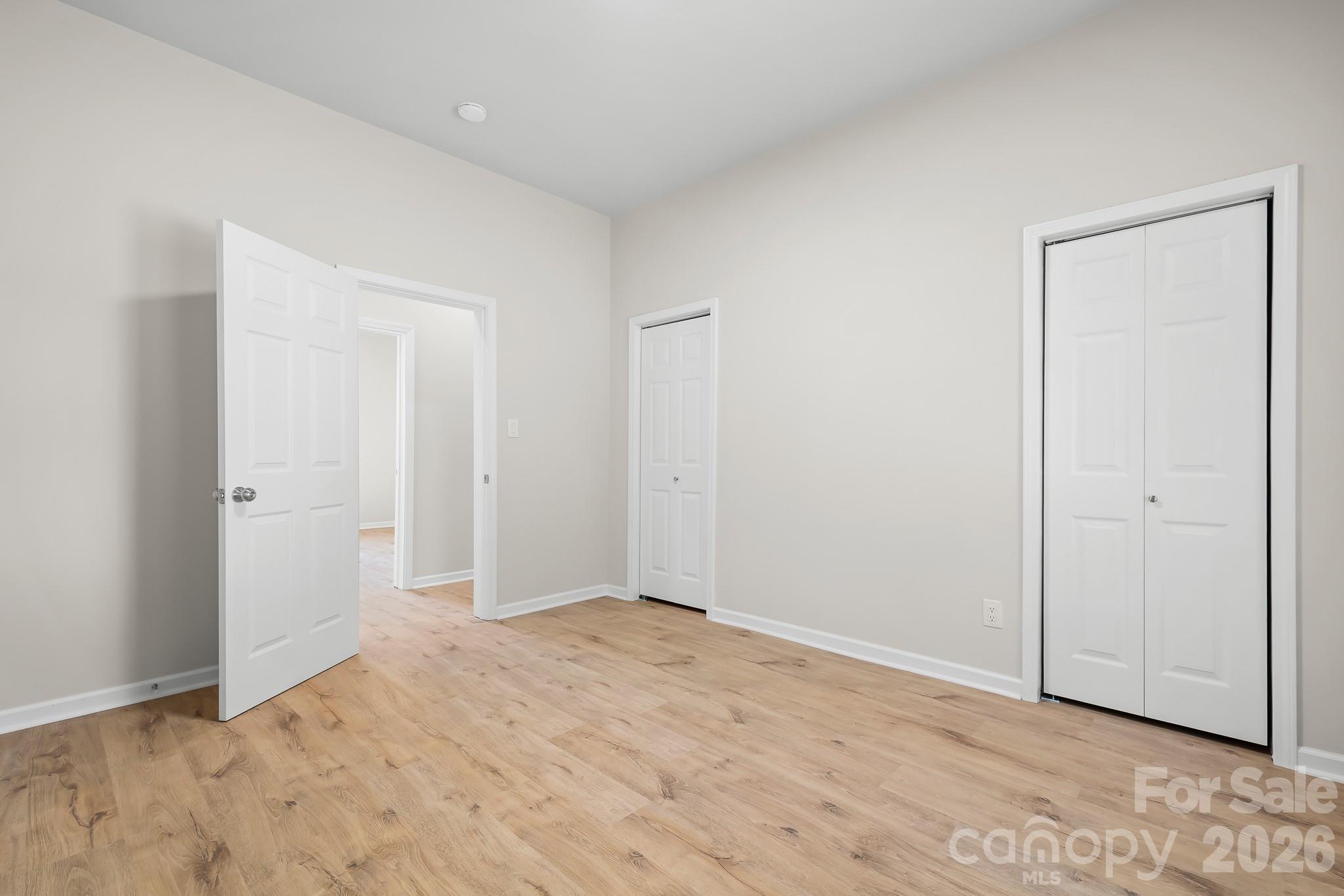 Spacious primary bedroom with two closets. - 104 1st Avenue, China Grove