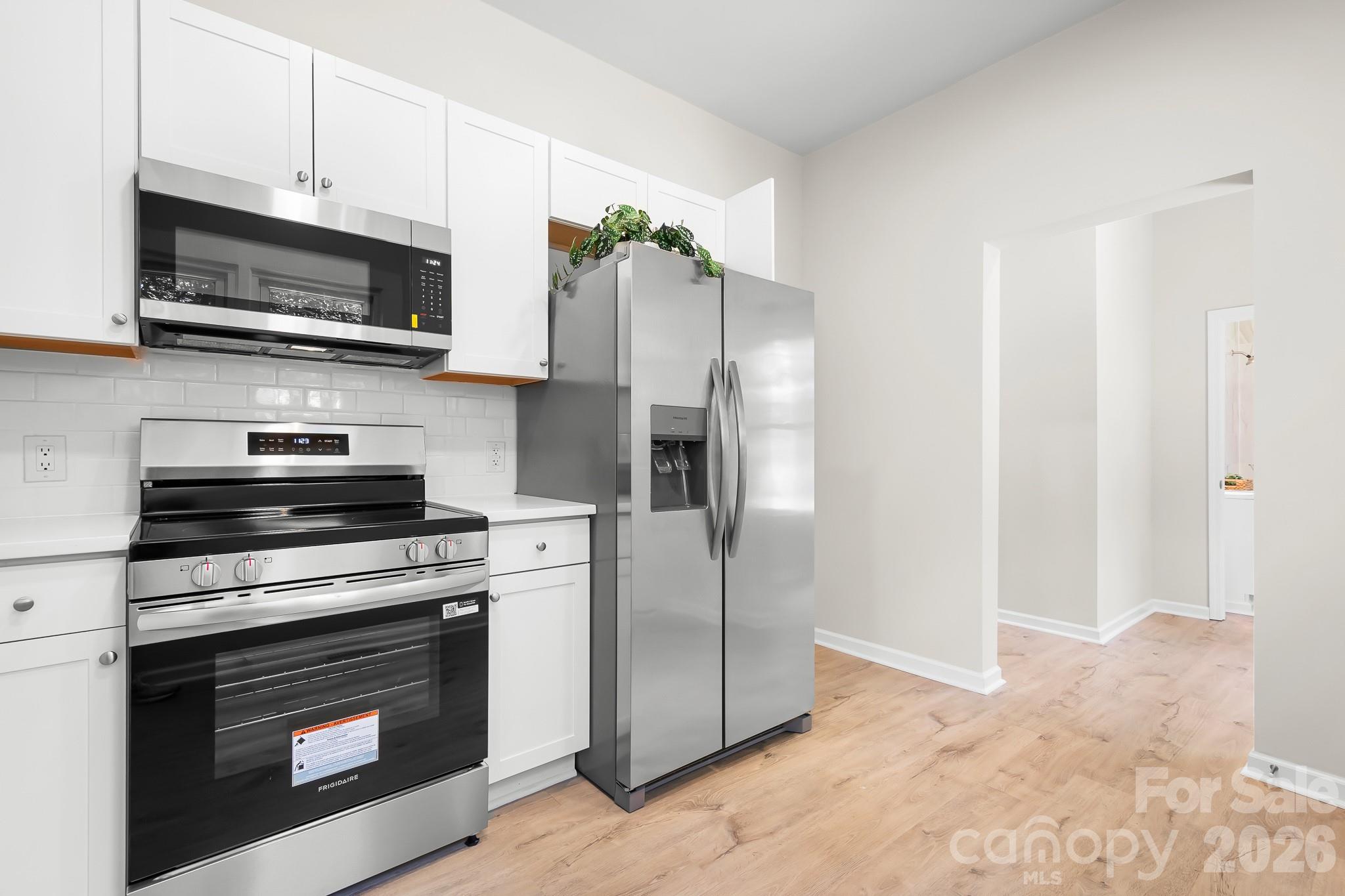 Bright kitchen with brand-new stainless steel appliances. - 104 1st Avenue, China Grove