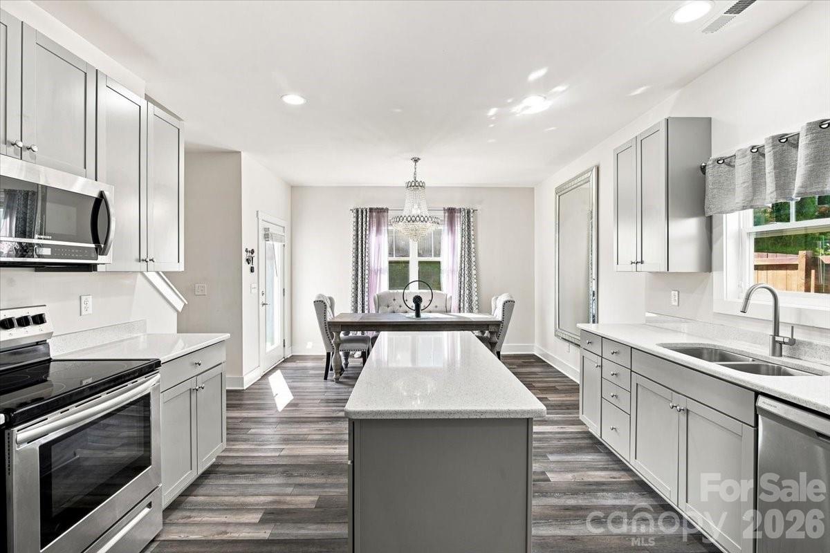 Gorgeous countertops throughout the entire kitchen. Pantry in the left corner - 15 Hyde Park Place, Arden