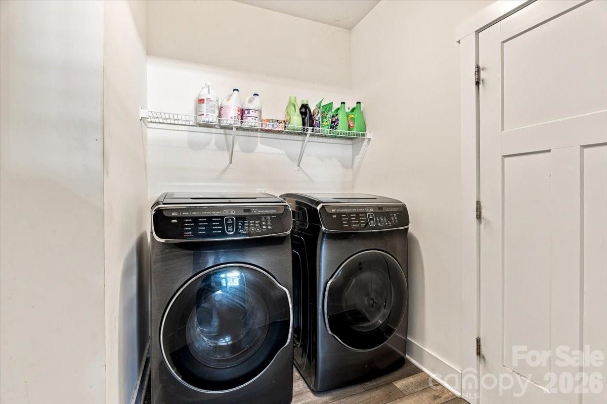 Separate laundry room on the main level - 15 Hyde Park Place, Arden