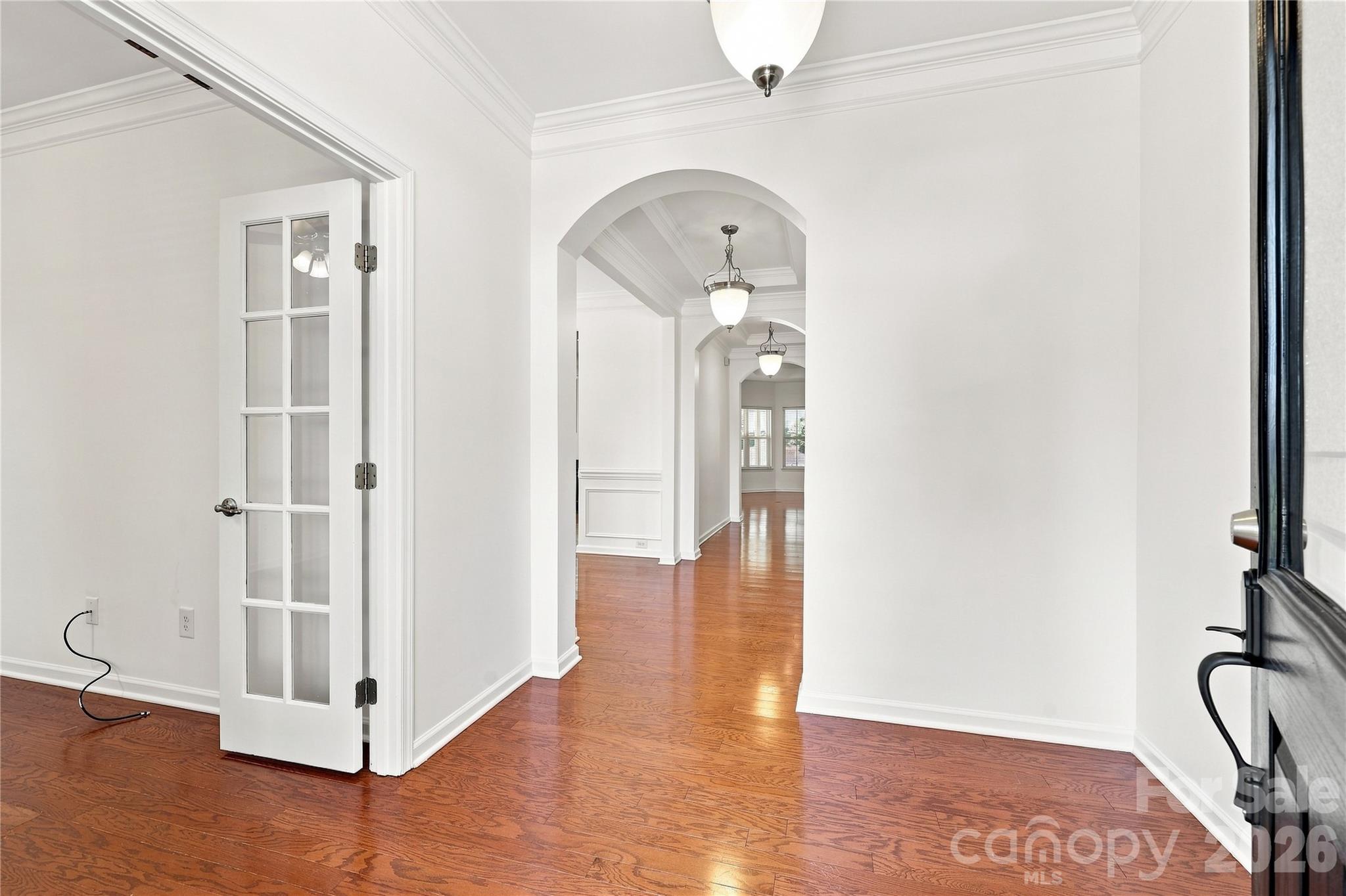Front entryway with office immidiately to the left followed by formal dining room leading to kitchen, which is open to the family room - 593 Harrison Drive NW, Concord