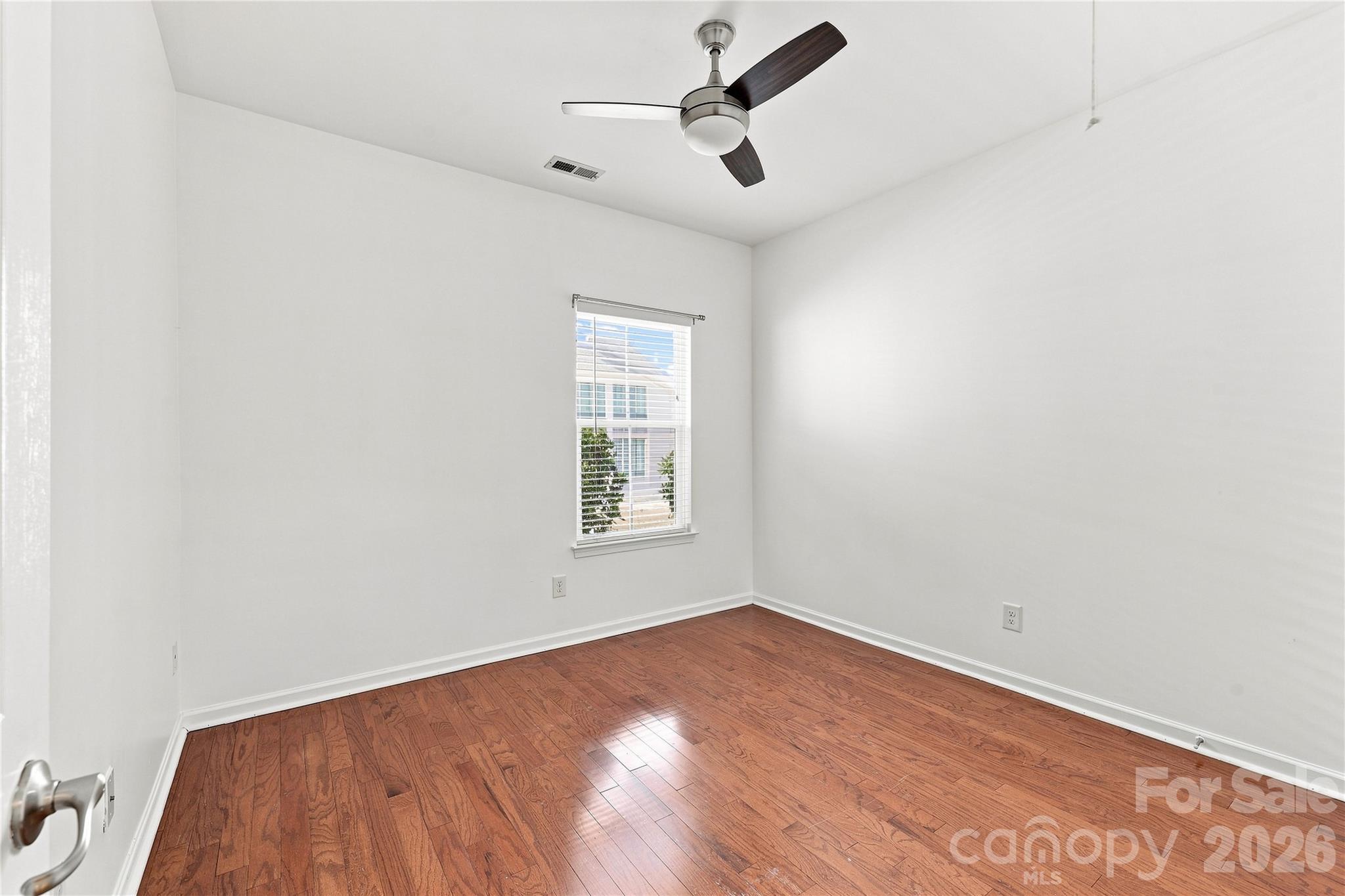 Second bedroom with ceiling fan - 593 Harrison Drive NW, Concord