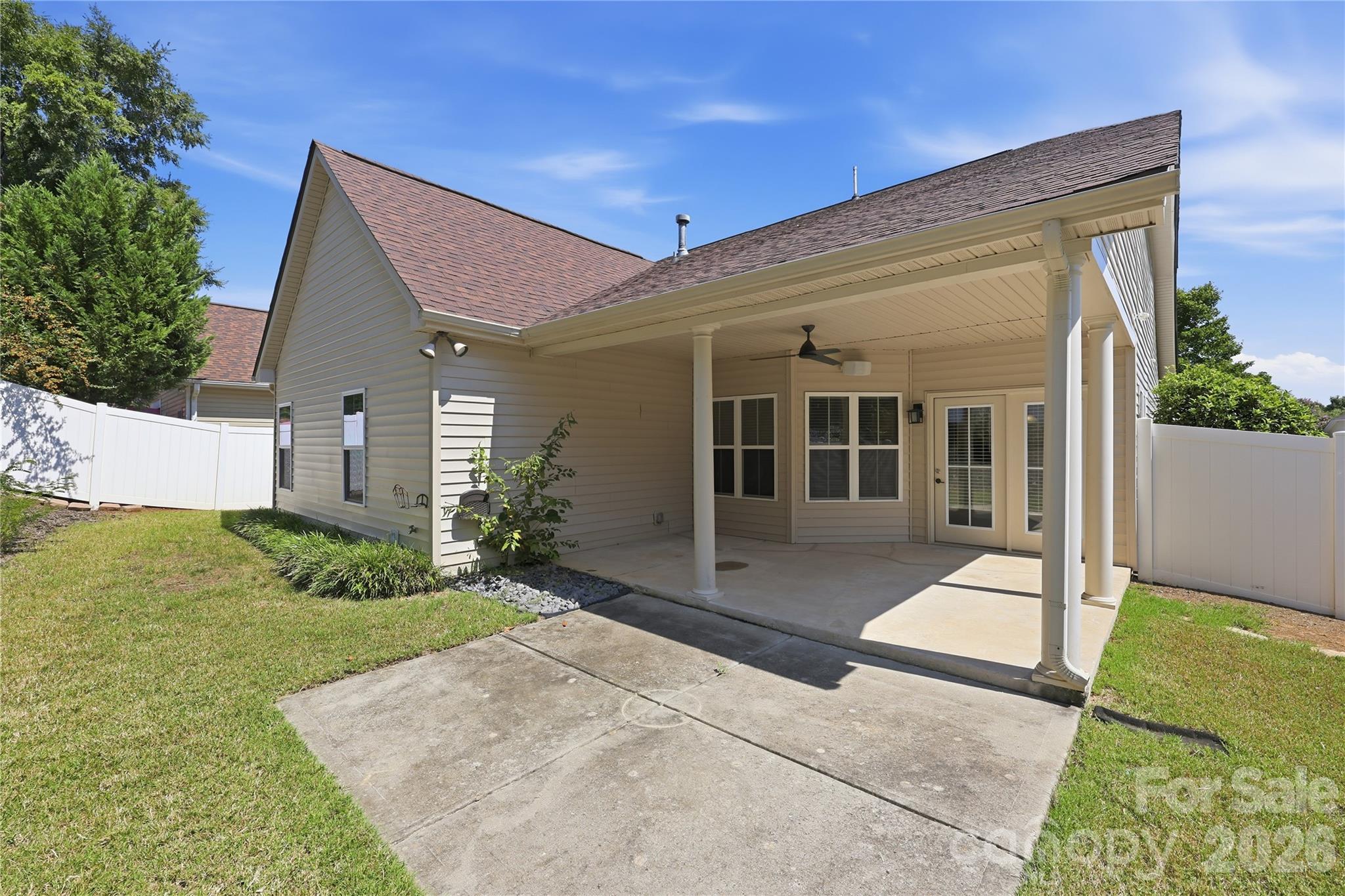 Large covered patio + extended patio - privacy white vinyl fence - 593 Harrison Drive NW, Concord