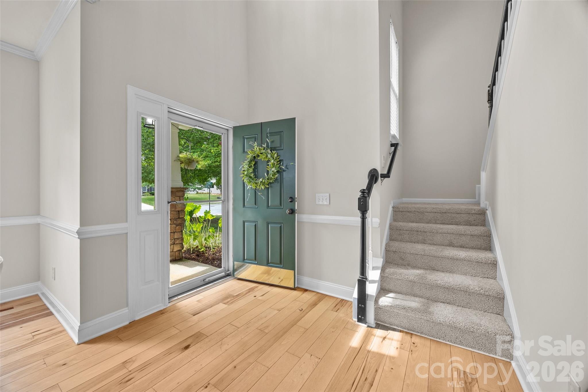 Entry- Solid Plank Hickory Floor Throughout Main Level - 9118 Spratt Lane, Waxhaw