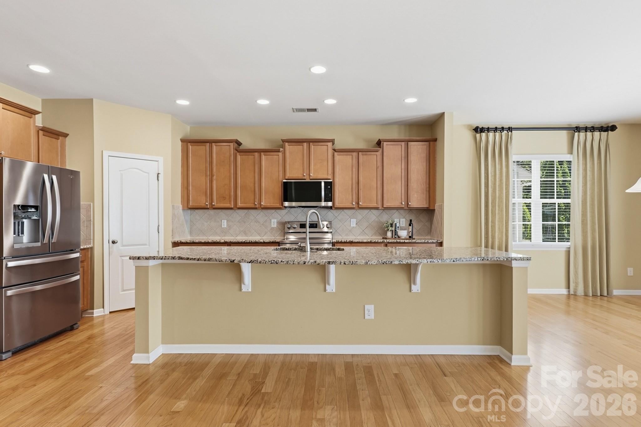 Spacious kitchen with large island, abundant cabinets and updated appliances - 4043 Perth Road, Indian Land