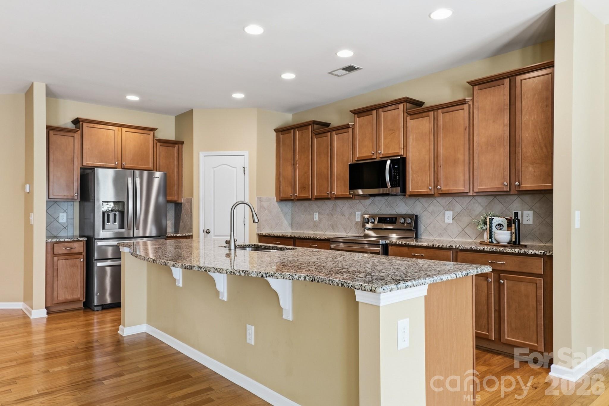 Spacious kitchen with large island, abundant cabinets and updated appliances - 4043 Perth Road, Indian Land