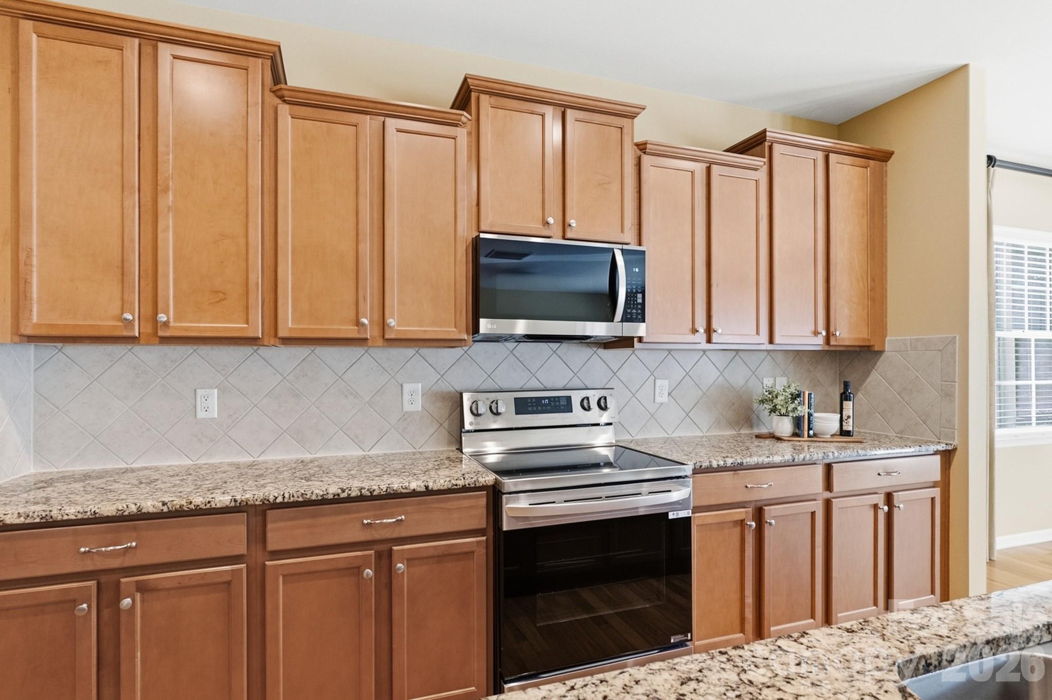 Spacious kitchen with large island, abundant cabinets and updated appliances - 4043 Perth Road, Indian Land