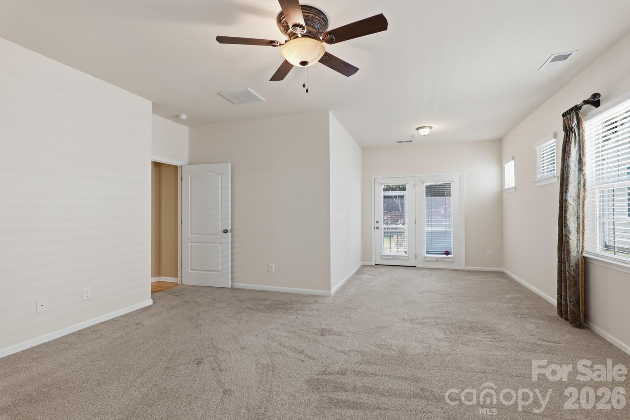 Primary bedroom with sitting area with direct access to the screened porch - 4043 Perth Road, Indian Land