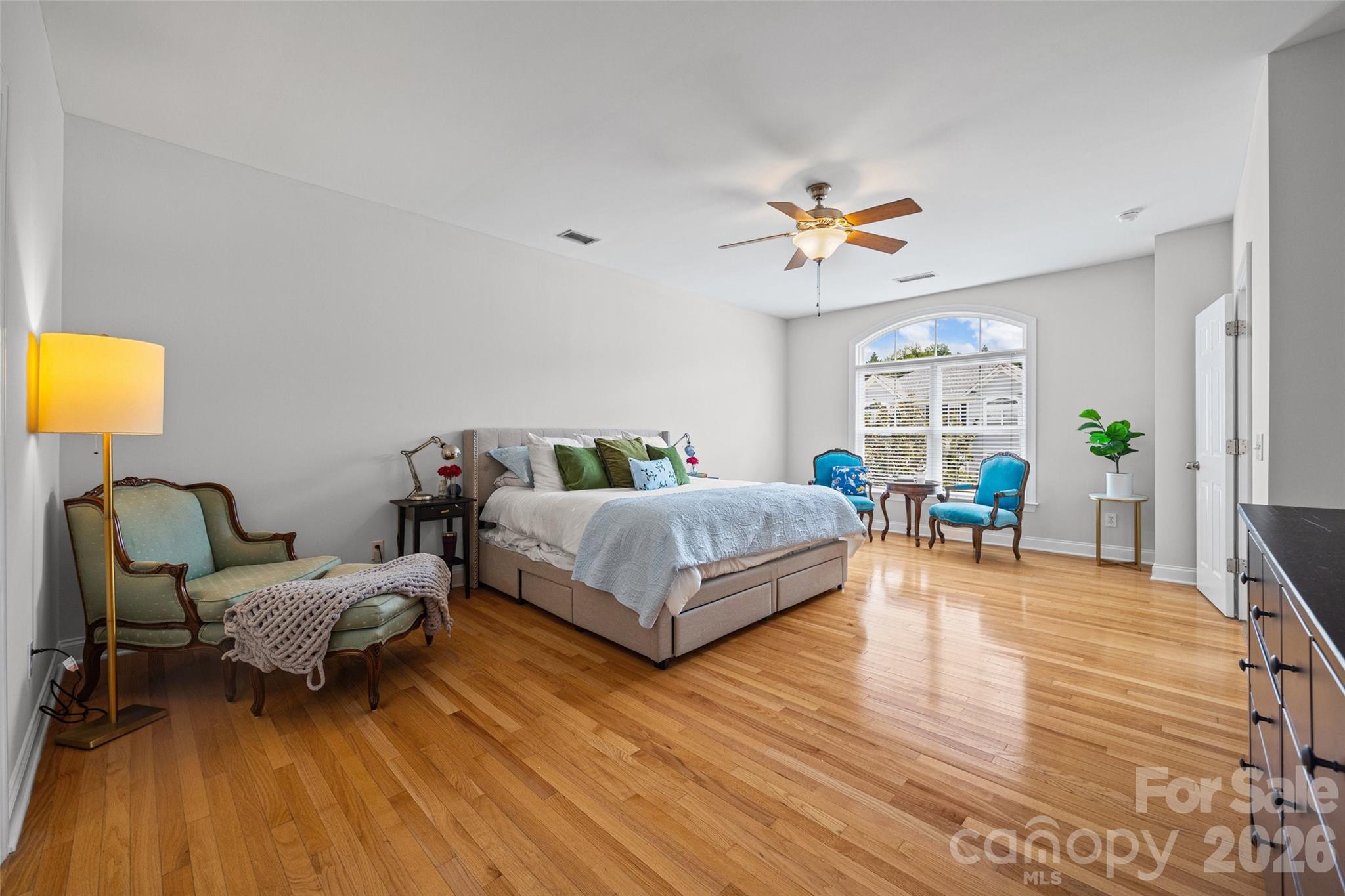 Hard wood flooring and lots of light in the primary bedroom - 1037 Fleming Lane, Matthews