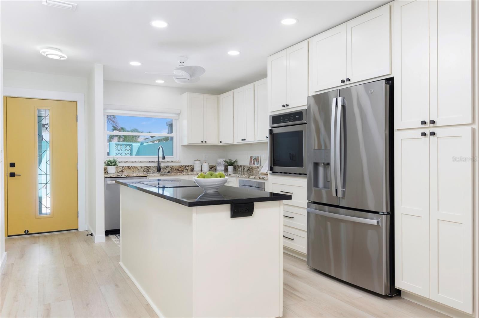 An entry breaks up the home. The kitchen has plenty of storage and counter space. - 382 BOCA CIEGA POINT BLVD S, ST PETERSBURG