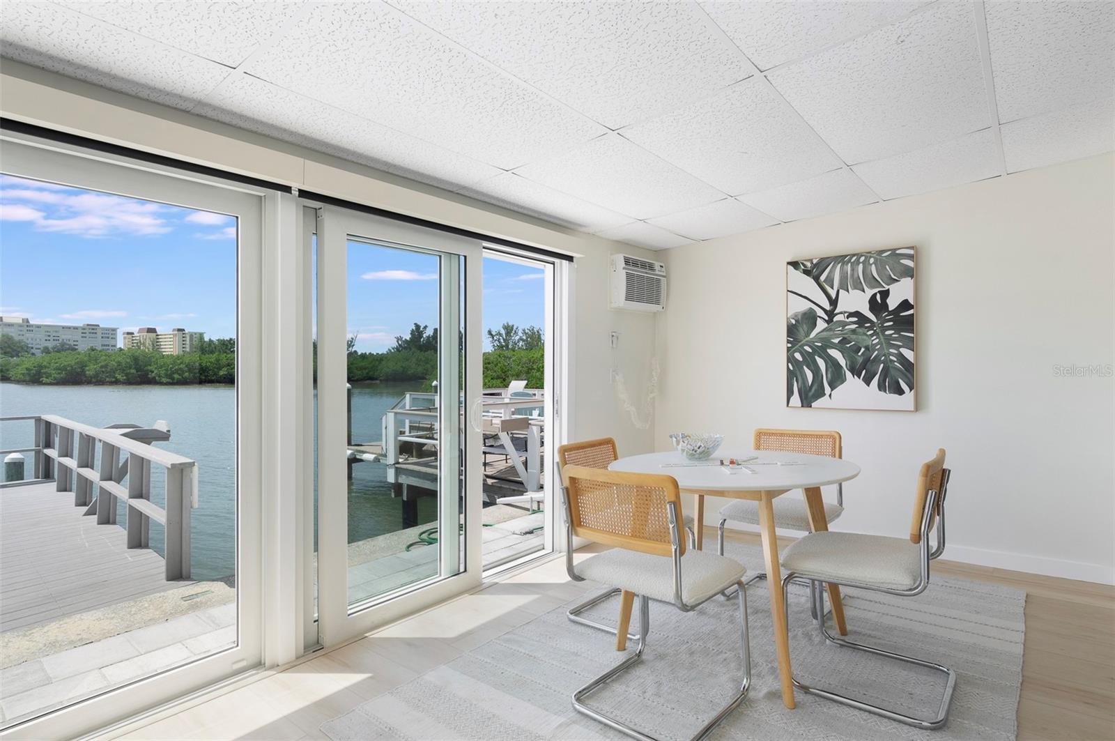 Flex Florida room features hurricane sliding glass doors. Remote Shades, too - 382 BOCA CIEGA POINT BLVD S, ST PETERSBURG