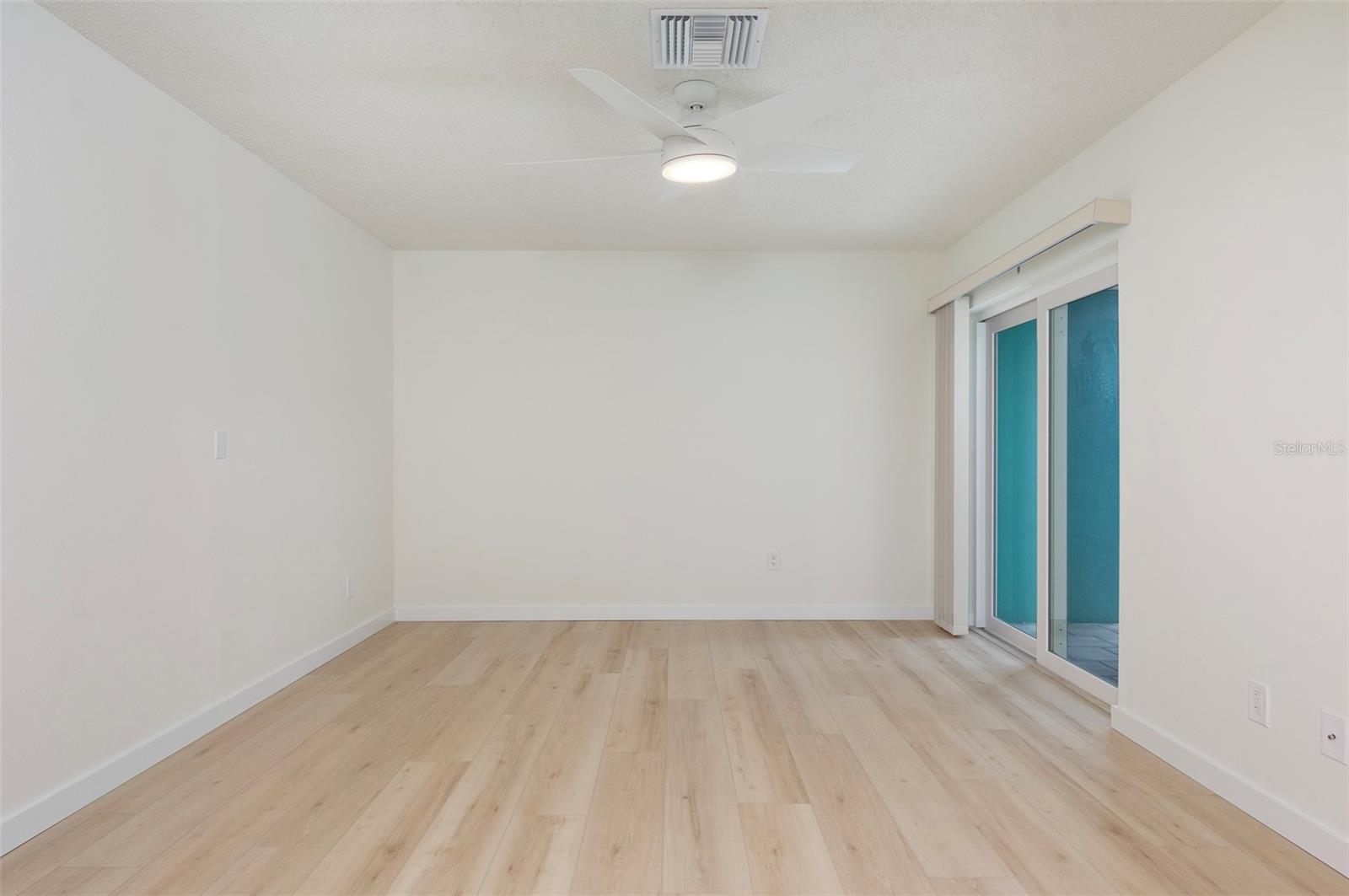Split Plan Bedroom #2 in the front of the house. Hurricane-rated sliders lead out to your private courtyard. - 382 BOCA CIEGA POINT BLVD S, ST PETERSBURG