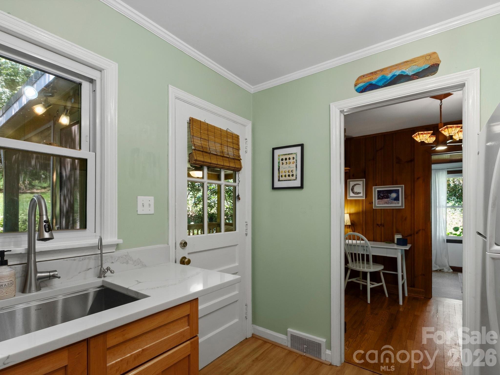 Kitchen Opens to Screened Porch - 28 Arthur Road, Asheville