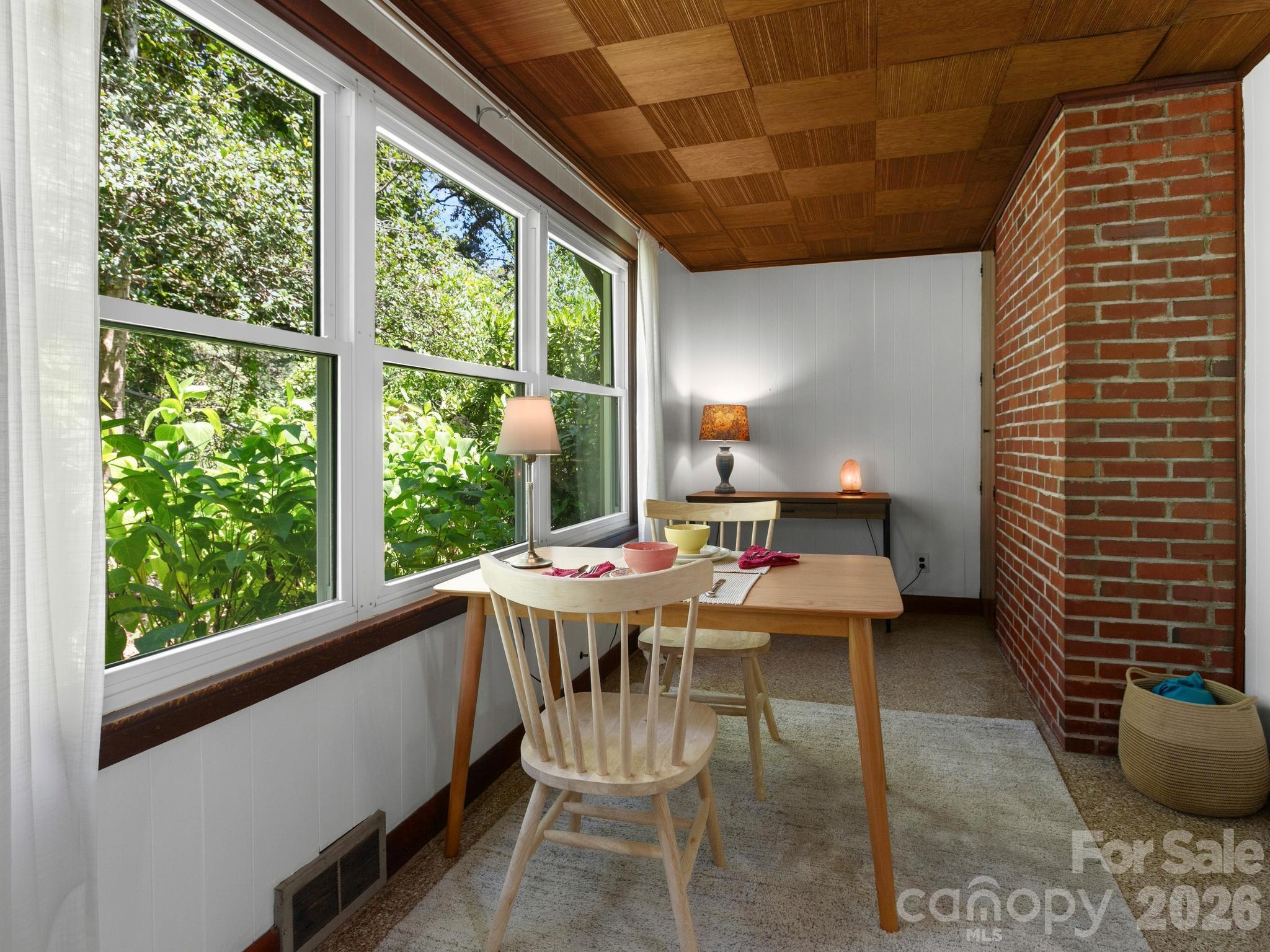 Currently the Sunroom off of Dining Area serves as a Dining and Hobby Space - 28 Arthur Road, Asheville