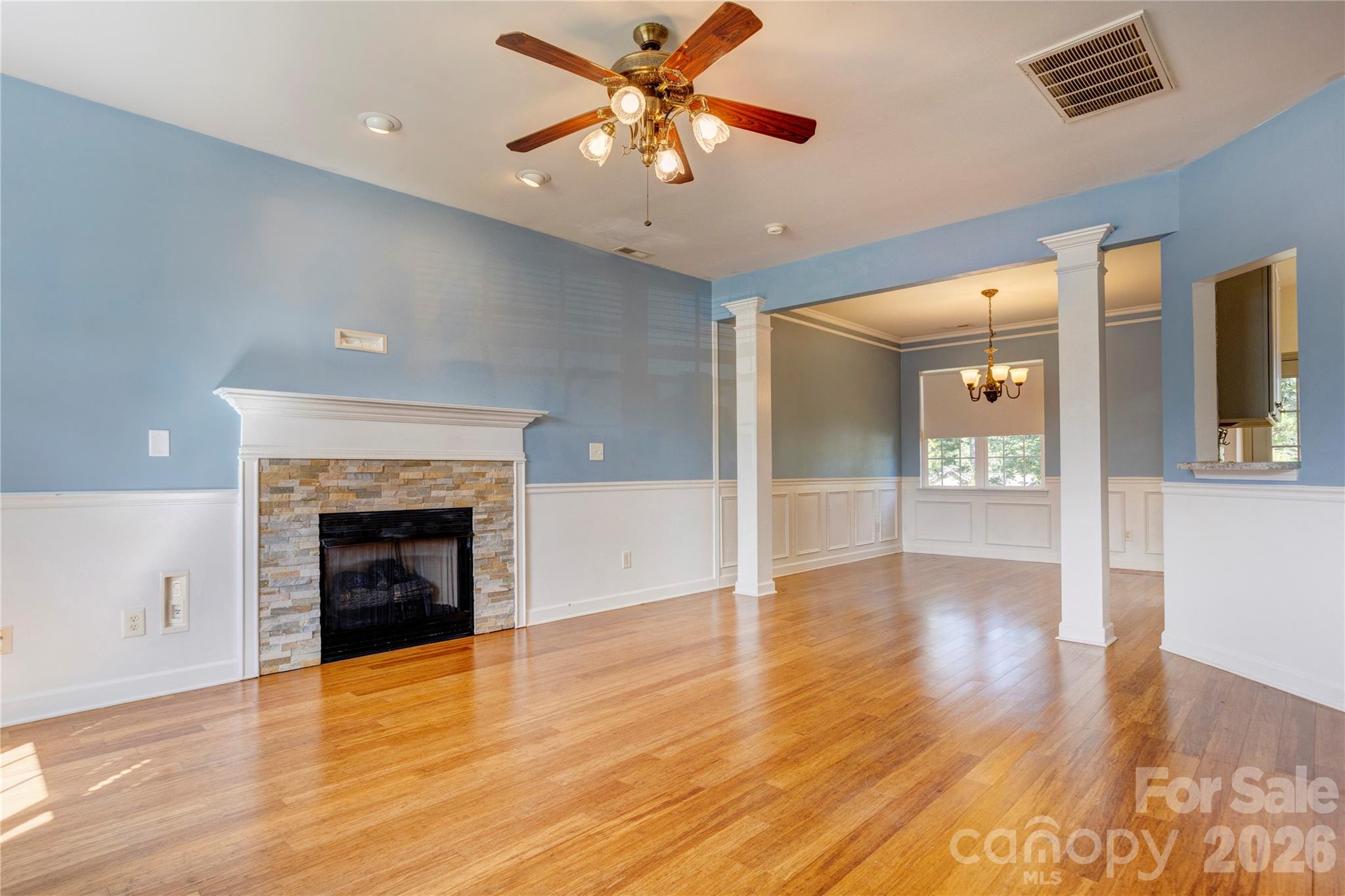 Family room with bamboo floors and gas fireplace - 4296 Deacon Court SW, Concord
