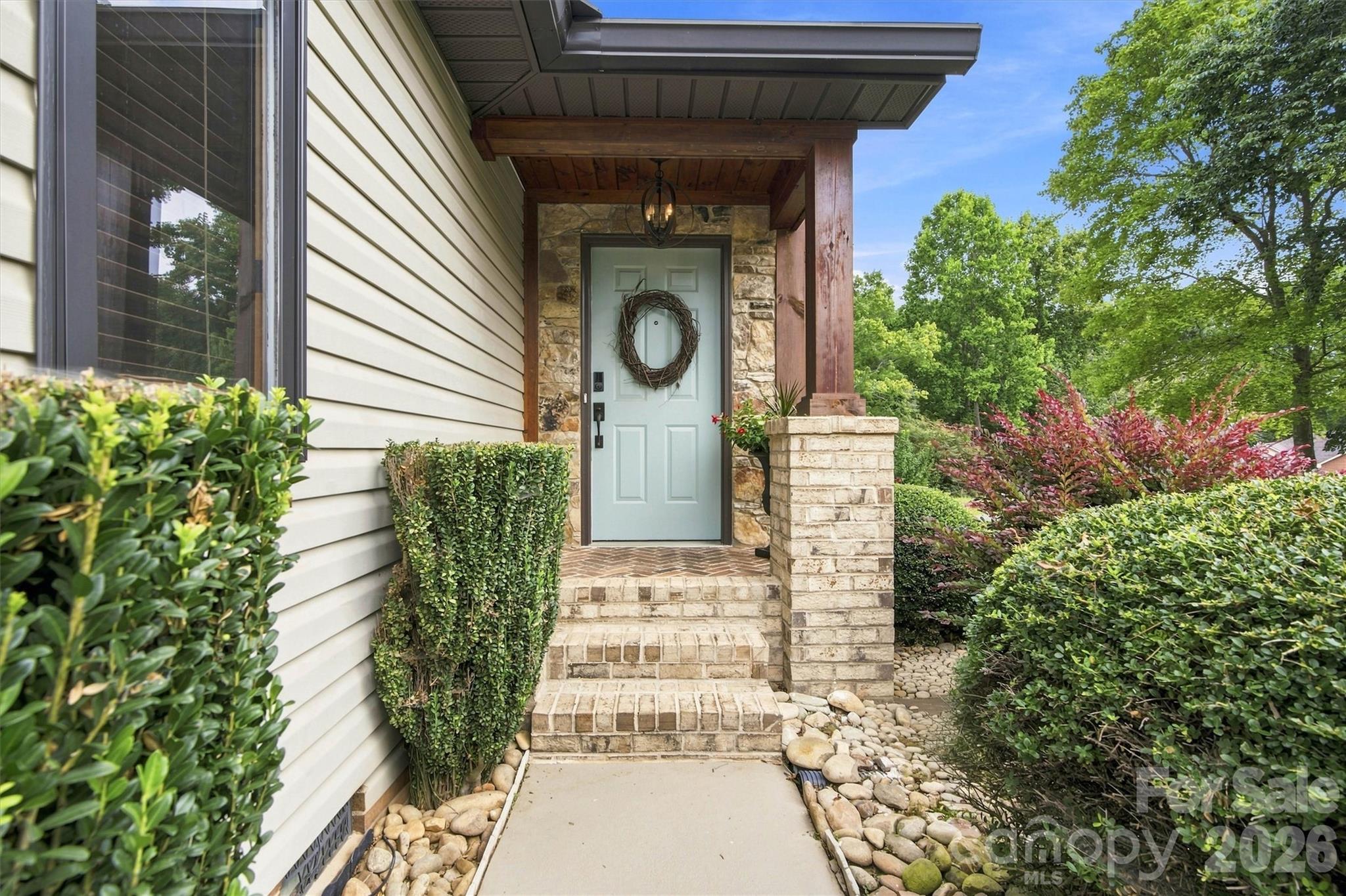Welcome home! Stylish stone/brick/wood entry features add so much character. - 3867 Angie Drive, Denver
