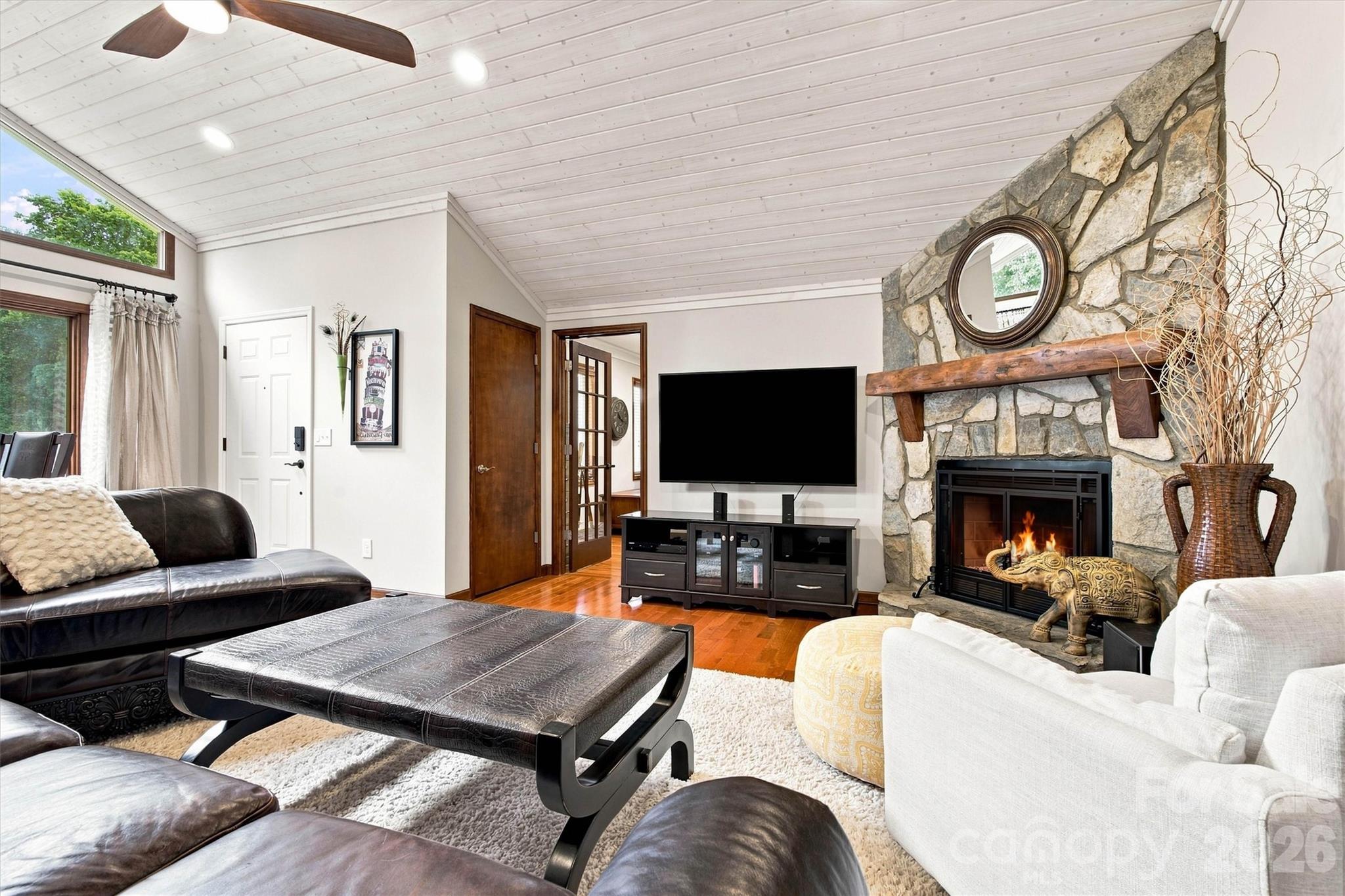 This spacious living area is perfect for hosting family and friends, offering the ideal cozy setting to enjoy evenings by the fireplace this winter. - 3867 Angie Drive, Denver