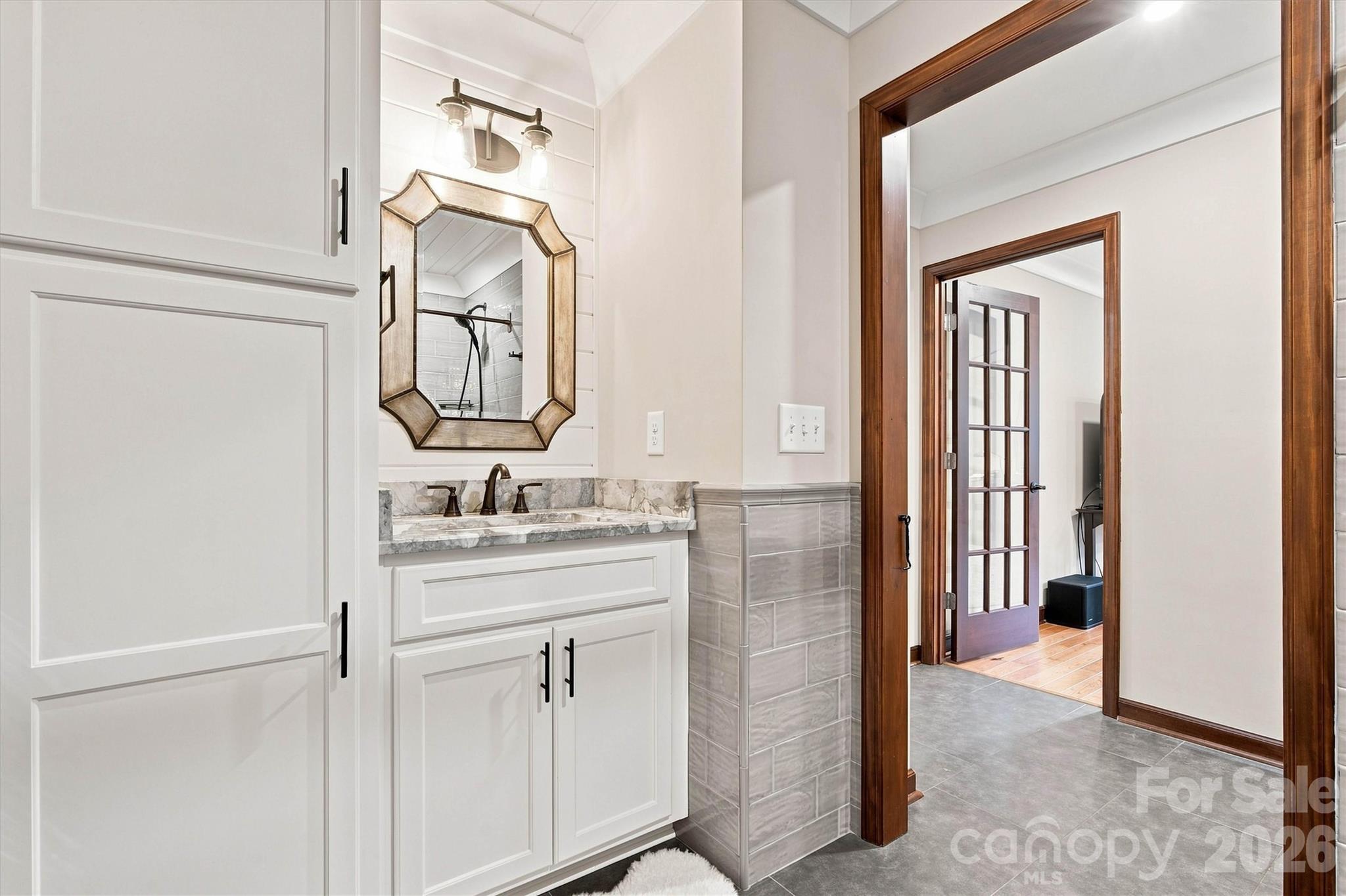 Mudroom Bath is completely custom and provides access from/to the pool area! - 3867 Angie Drive, Denver