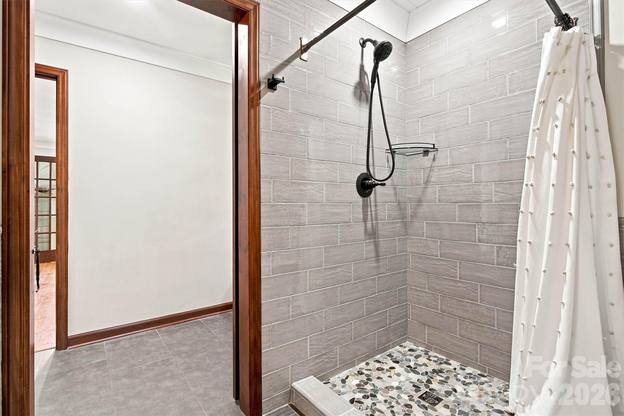 Full custom tile shower makes showering after enjoying the pool a breeze! Also good for dog baths! - 3867 Angie Drive, Denver