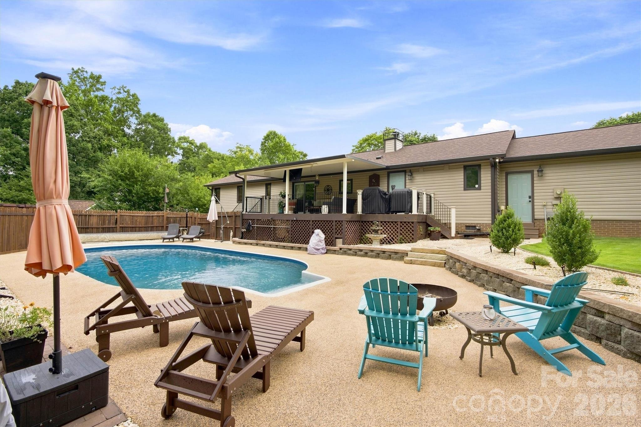 Lots of room for fun in the sun! New rubber deck coating makes the pool area so much more inviting! Firepit is ready to be fired up! - 3867 Angie Drive, Denver