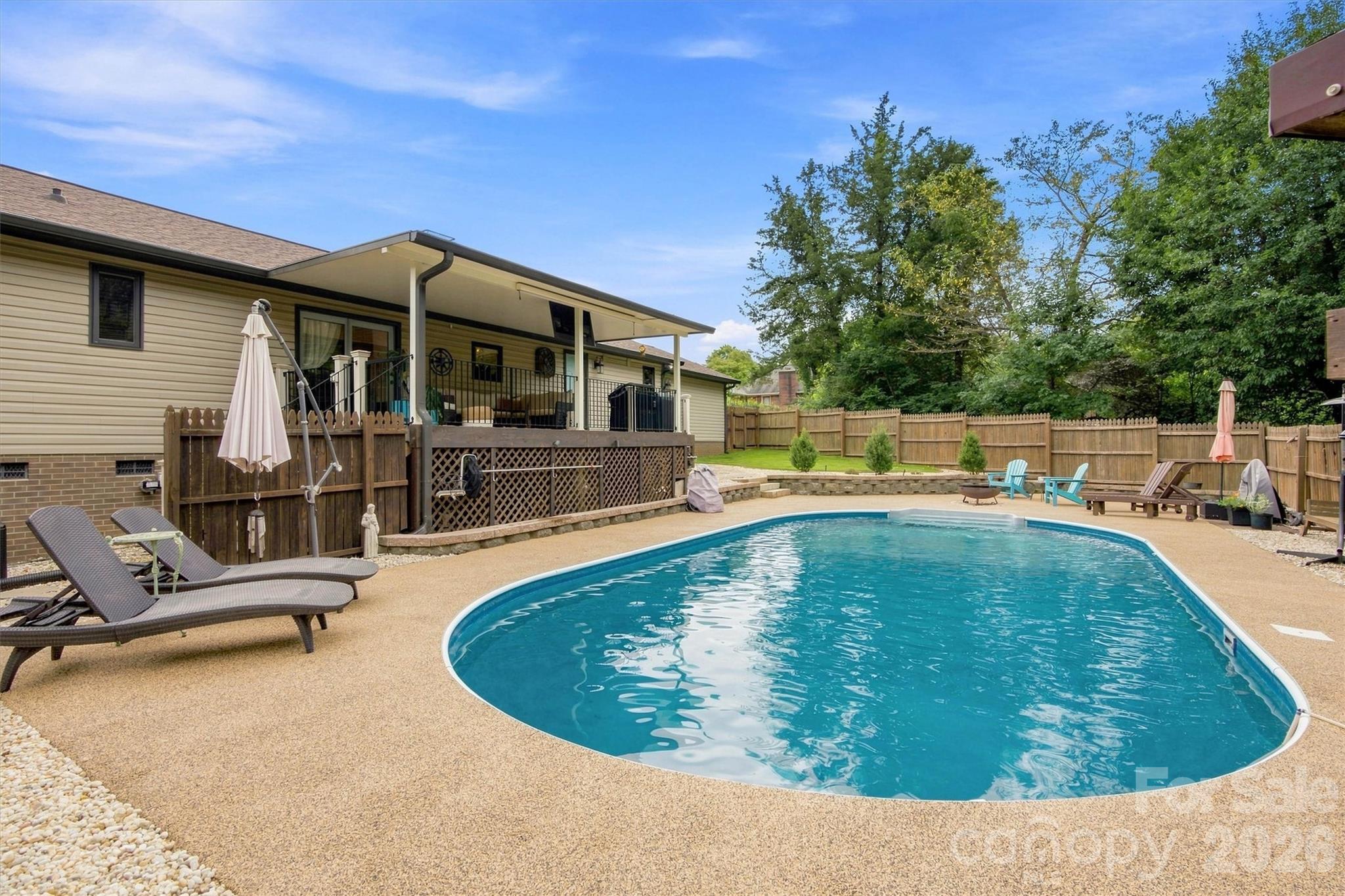 Gorgeous hardscaping and landscaping make this back yard a real oasis! Solar heated pool can be enjoyed well into the cooler months! - 3867 Angie Drive, Denver
