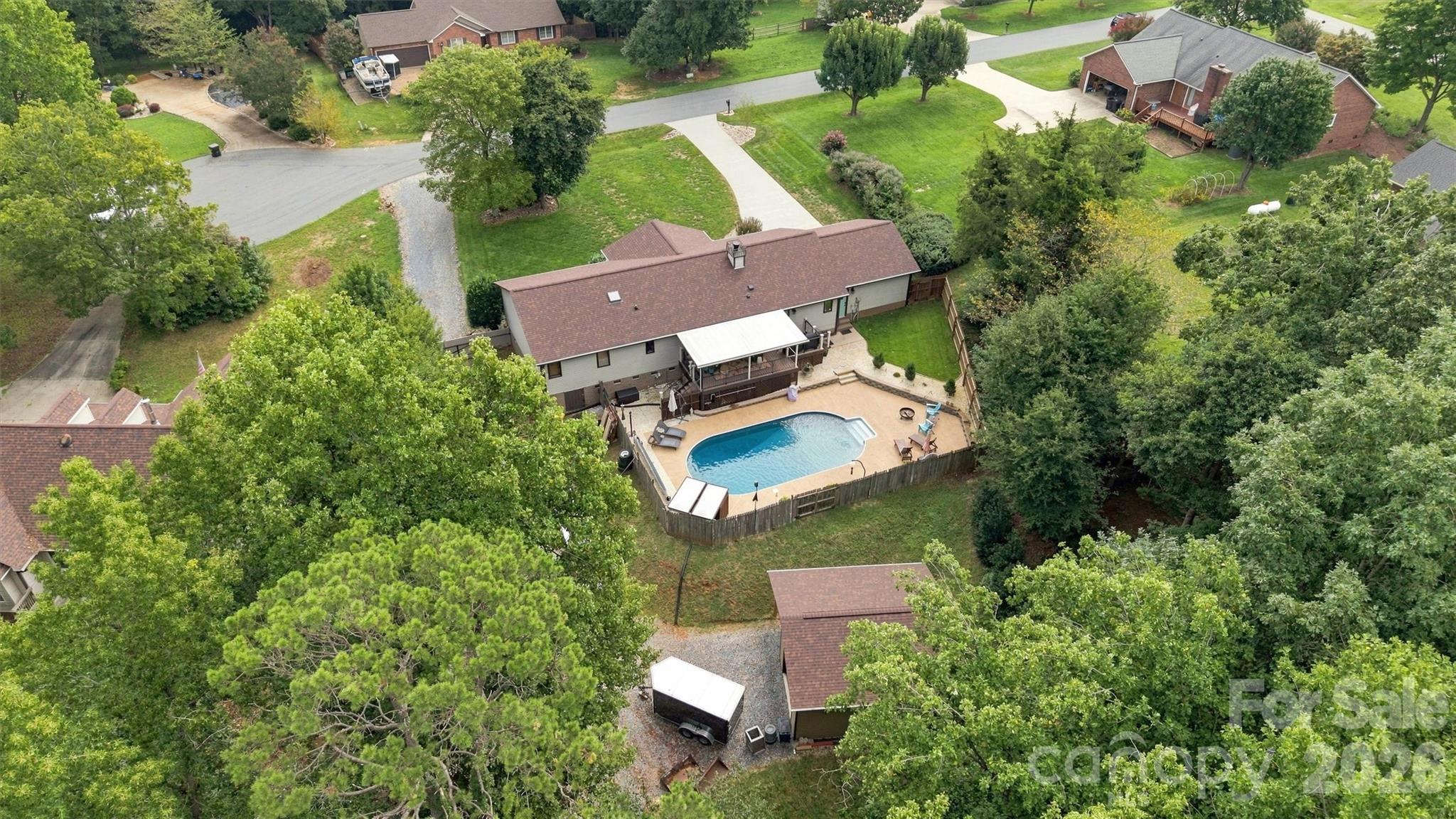 This property has been created to utilize the space wisely. Detached garage/workshop is hidden behind the home and pool area, completely out of sight. - 3867 Angie Drive, Denver