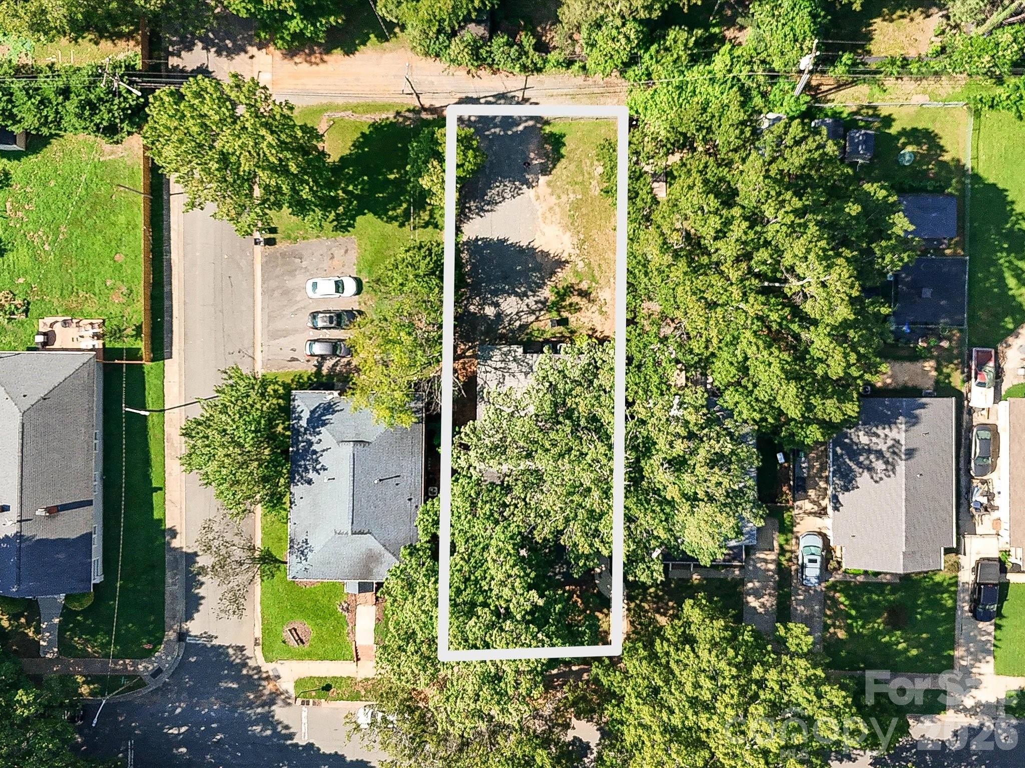 Aerial view highlights the property footprint and generous lot, showcasing the potential for a Charlotte investment or new construction opportunity. - 305 Keswick Avenue, Charlotte