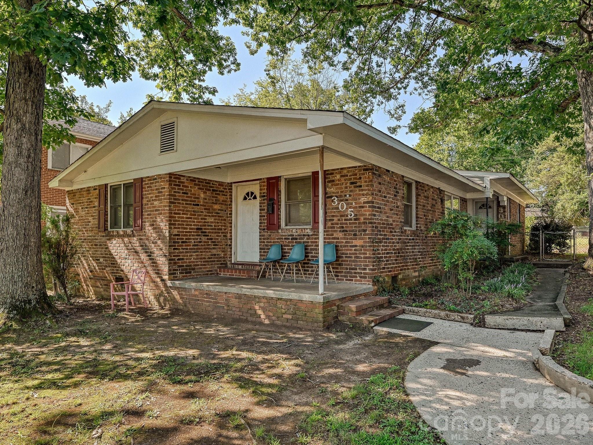 Existing brick duplex in Charlotte offers an investment opportunity with potential for rental income, renovation, redevelopment, or future new construction. - 305 Keswick Avenue, Charlotte