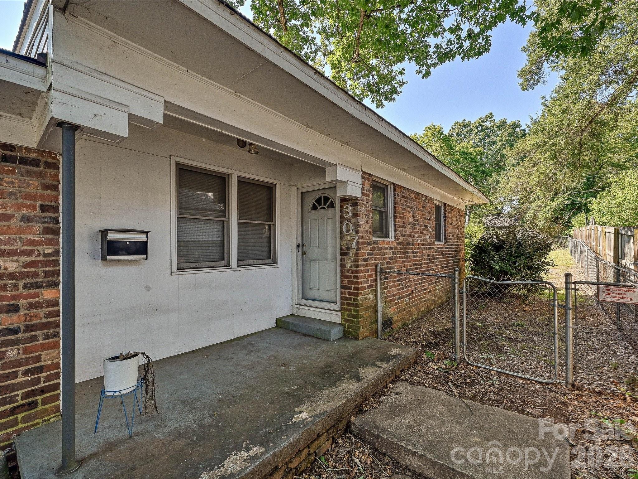 Charming all-brick duplex at 305 Keswick Avenue offering incredible investment potential, a spacious lot with mature trees, and a prime Charlotte location just minutes from Uptown and Camp North End. - 305 Keswick Avenue, Charlotte