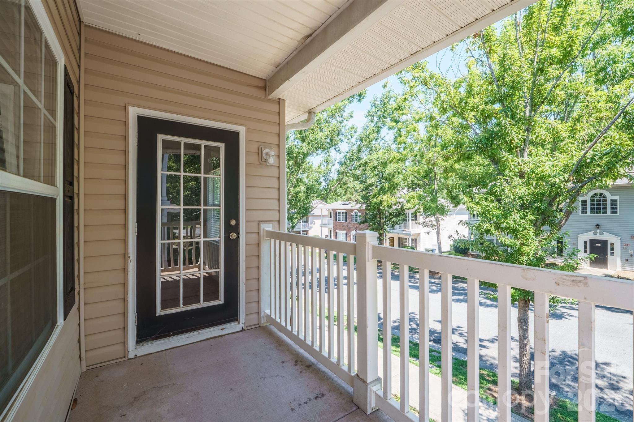Front balcony where you feel your in the trees, shades the porch - 21246 Hickory Street, Cornelius