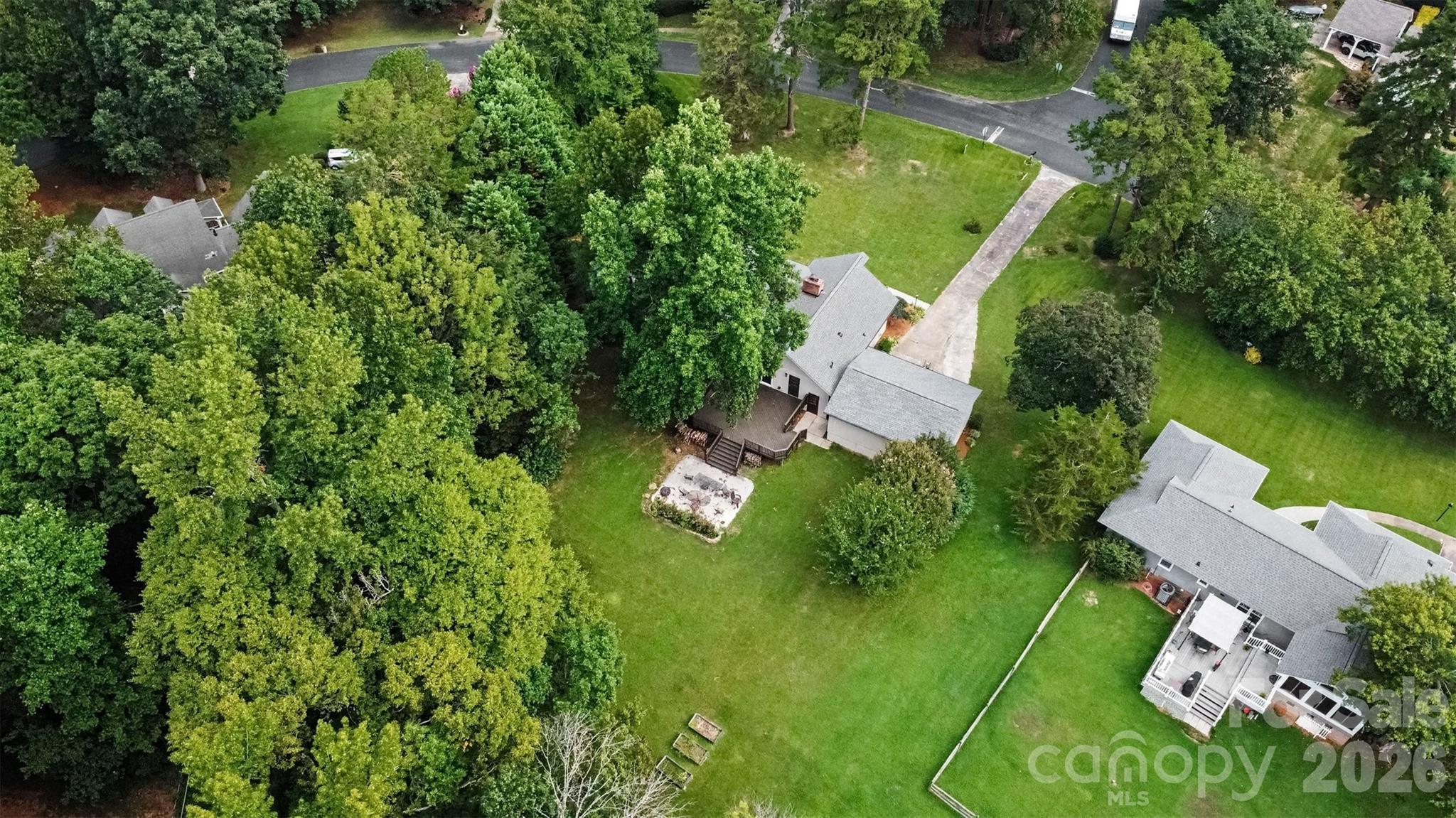Love all the mature trees around your new home. - 13520 Andulusian Drive, Matthews
