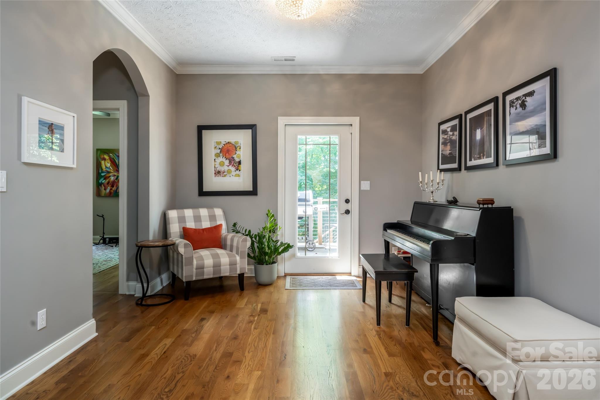 Flex area off kitchen with pantry/ storage closet adjacent, upper deck access to gas grill, and arched access to bedrooms #2 and #3 with shared full bath - 170 Cape Martin Circle, Hendersonville