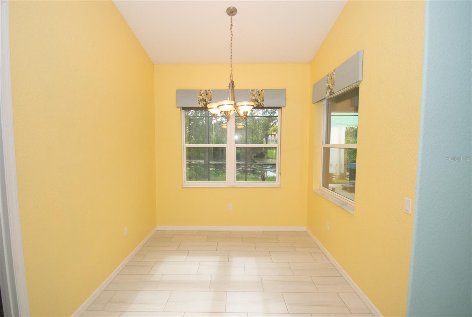Breakfast nook overlooking the freshwater canal, enjoy your morning coffee while watching nature unfold in your own backyard. - 225 BIRCHWOOD DR, PALM COAST