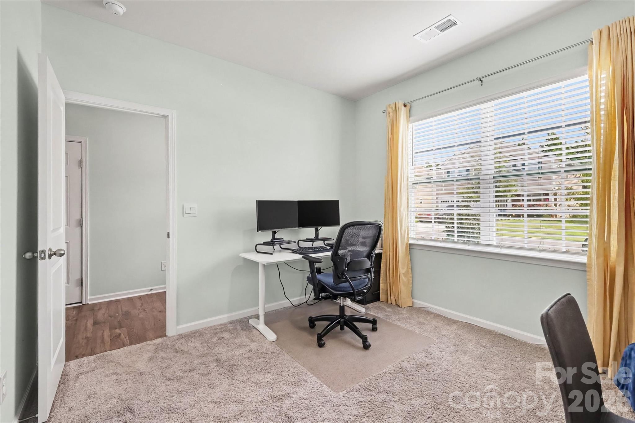 Large windows at front of home - 7594 Stonehouse Drive, Gastonia