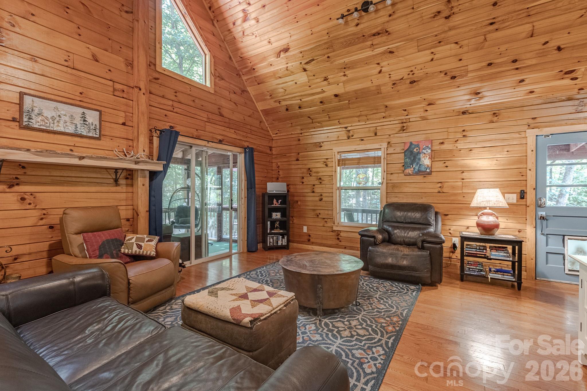 Living room looking at front door & doors to screened porch. - 257 Adirondack Trail, Nebo