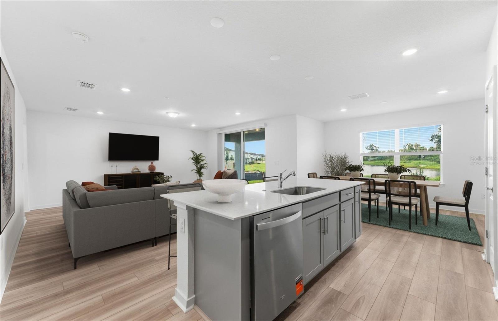 Virtually Staged - Open Kitchen to Cafe to Gathering Room - 9885 TRELLIS VINE WAY, PARRISH