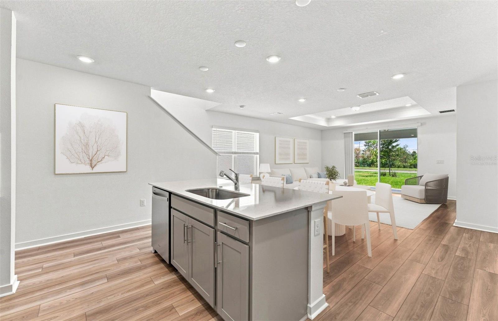 Virtually Staged - Open Kitchen to Cafe to Gathering Room - 7923 PALM PARADISE PL, PARRISH