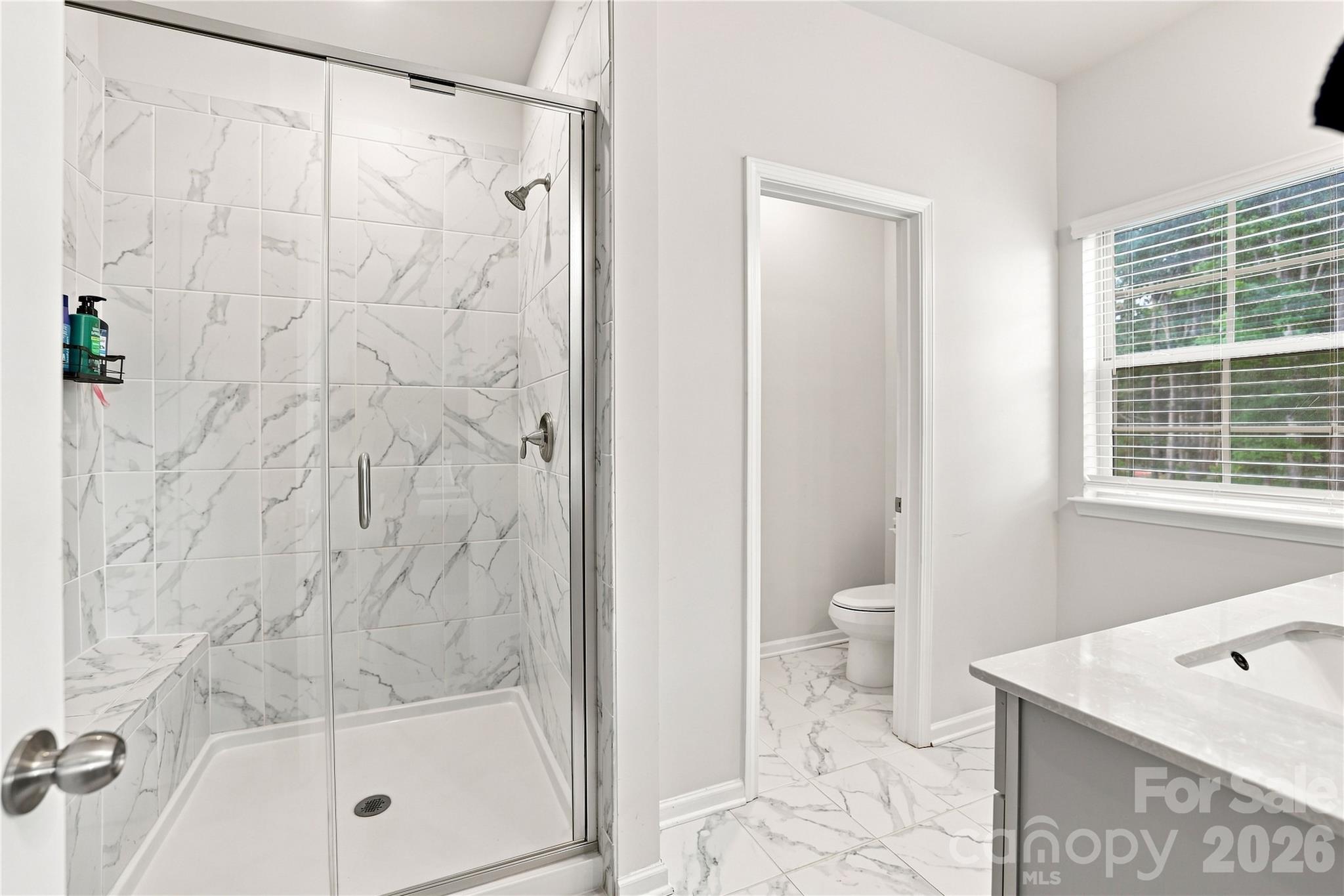Primary Bath walk in shower with bench - 2327 Mount Harmony Ch Road, Matthews