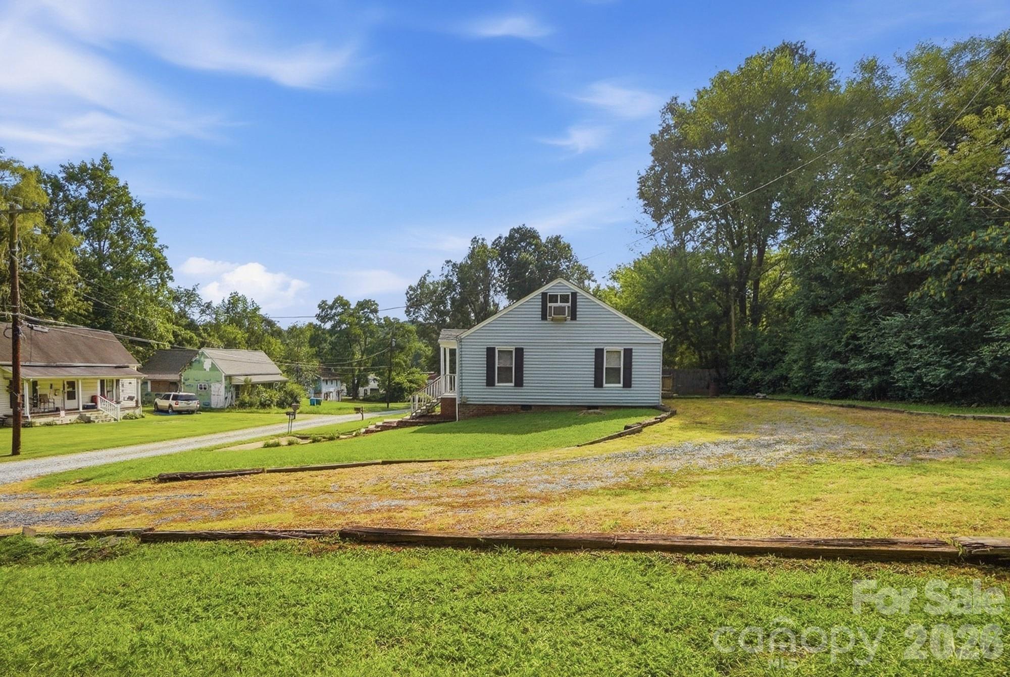 Lots of space for guests to park in the driveway, Driveway leads around tor the back of the home - 714 Parker Street, Albemarle