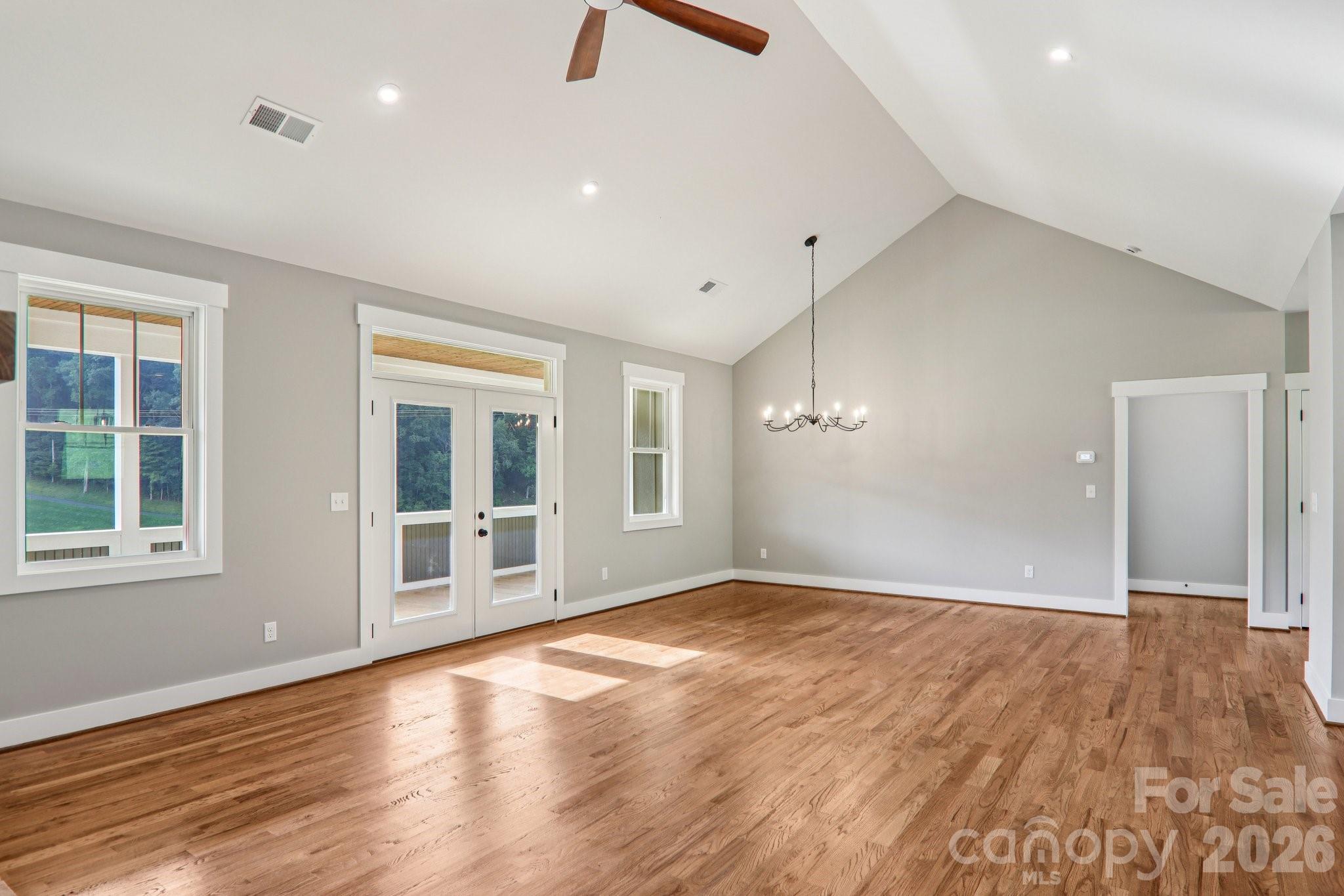 Dining Room/Living room leads out onto the covered deck. - 1060 California Creek Road, Mars Hill