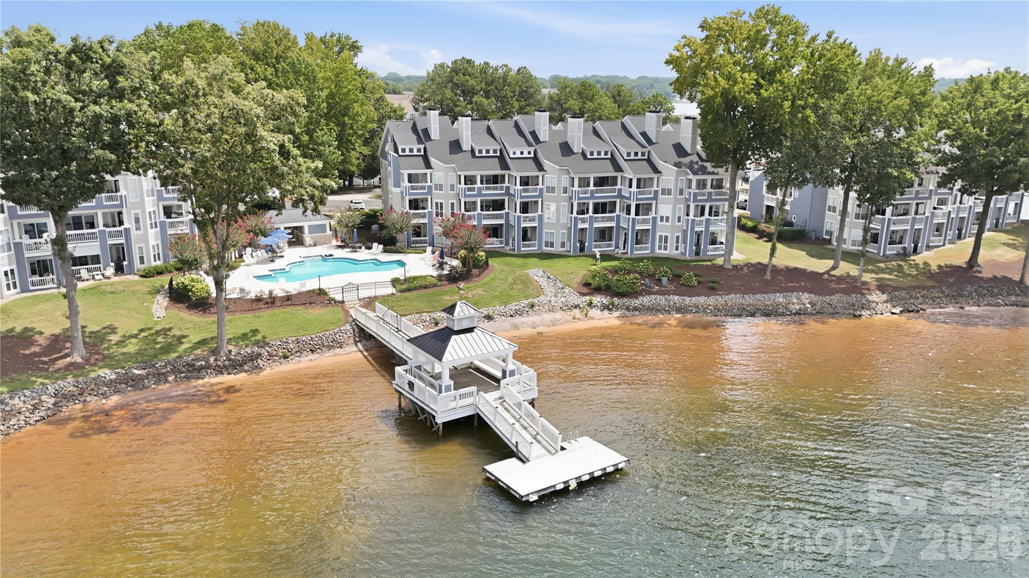 Floating dock enhances the community’s lakeside amenities. - 932 Southwest Drive, Davidson