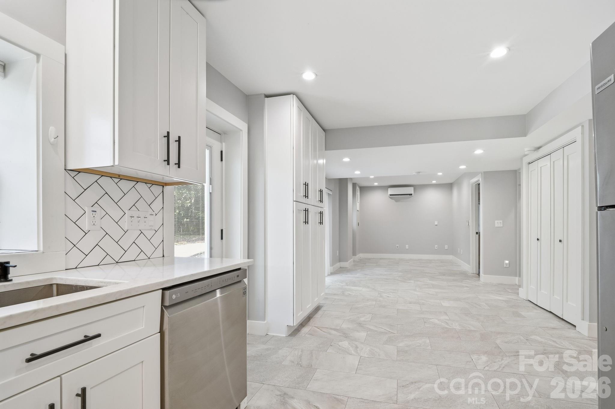 Looking from Lower unit kitchen to dining and living room - 77 Trotter Place, Asheville