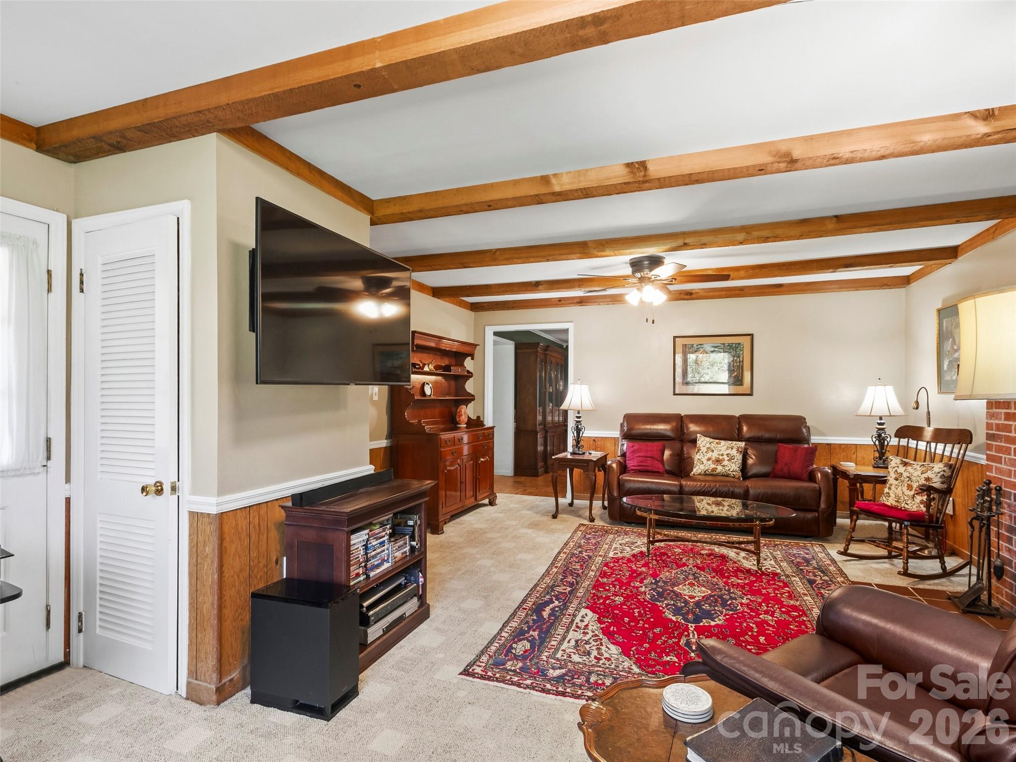 Cozy living room with accent beams - 101 Castlerock Drive, Asheville