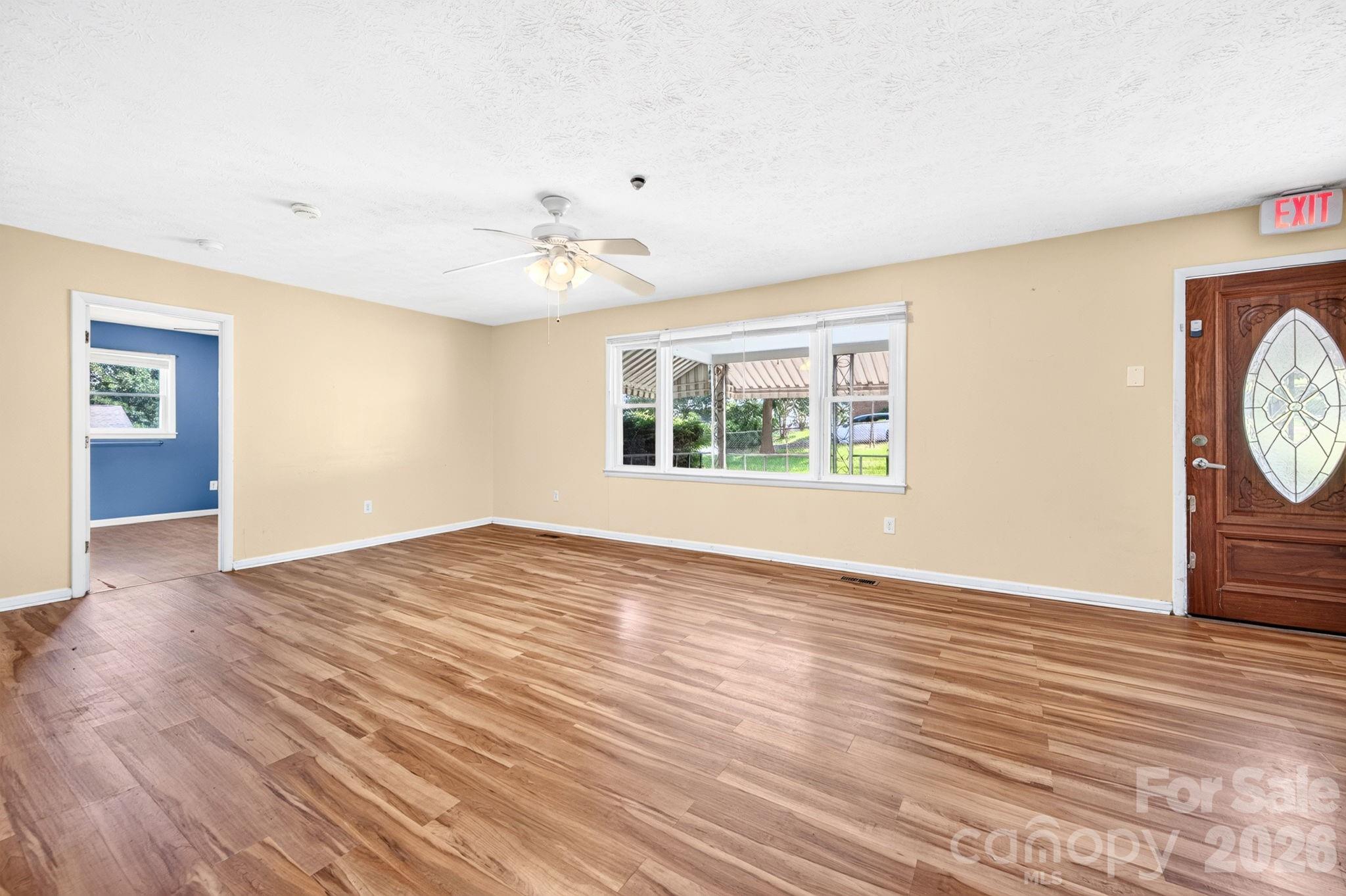 Entering front door is a large living room - 483 Caribou Road, Asheville